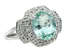 Paraiba-Turmalin-Ring mit Ovalschliff und doppeltem Diamant-Halo 18 Karat Weißgold