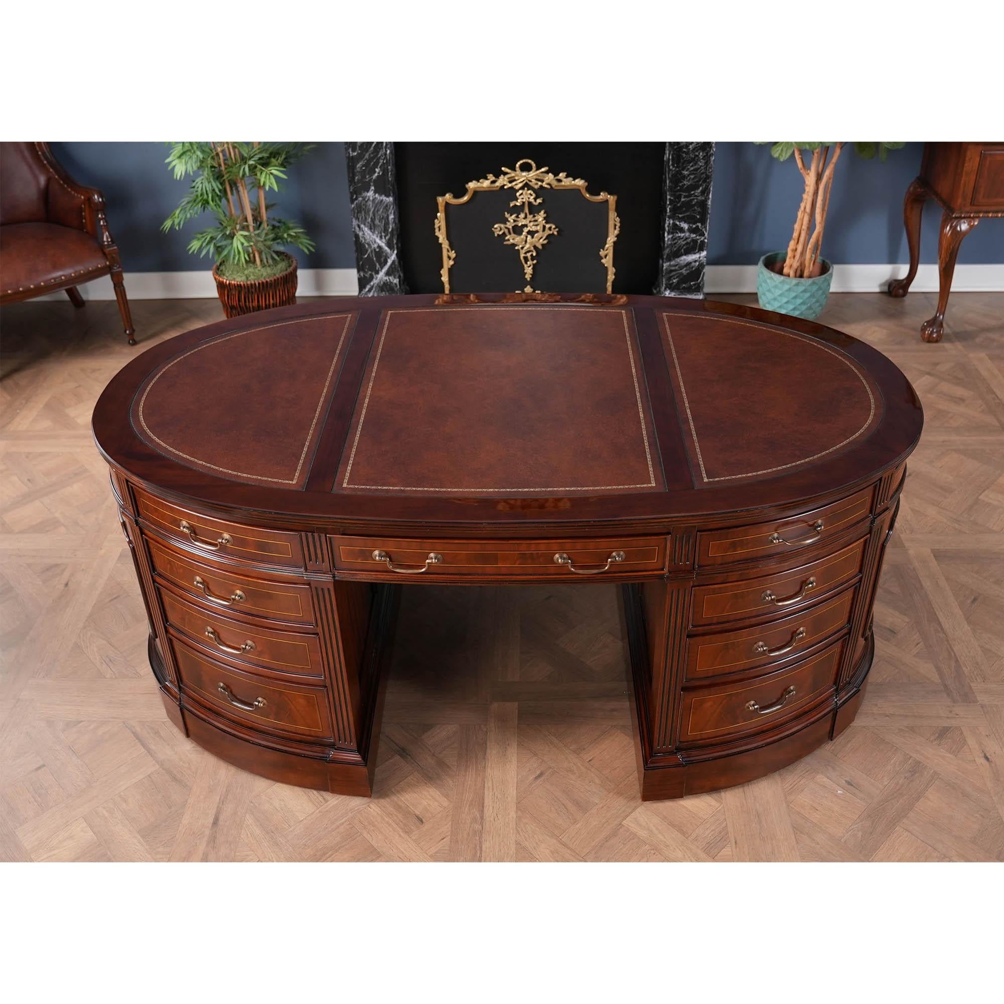 One of the most complicated items that we produce at Niagara furniture our Oval Partners Desk is also one of the most popular. The top section of the desk consists of a three-paneled writing surfaces of brown full grain genuine leather which feature