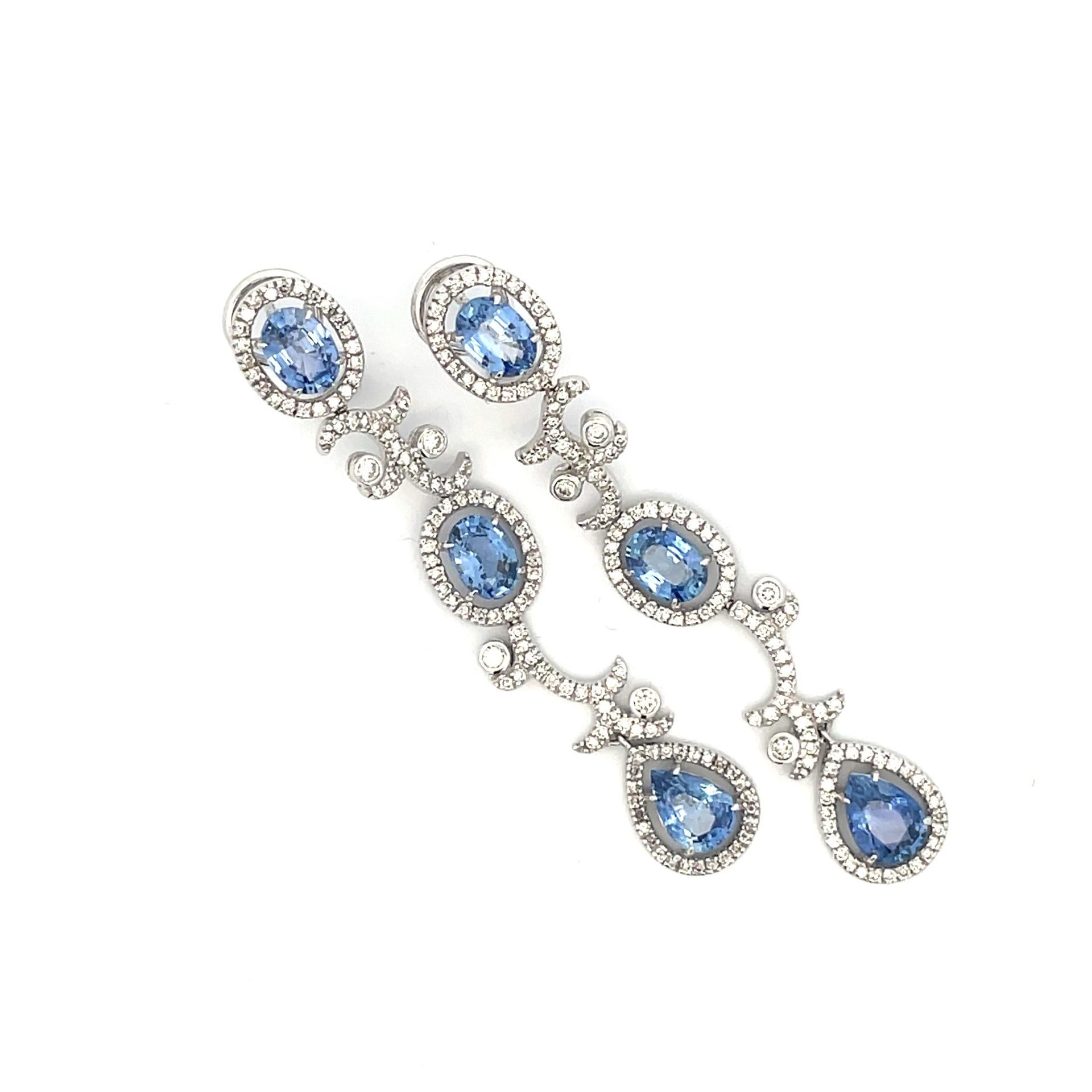 A pair of 18kt white gold oval and pear shape earrings set with natural oval and pear shape Ceylon blue sapphires and white diamonds with straight post and omega clip system. Add an elegant touch to any special occasion!

2 natural pear shape Ceylon