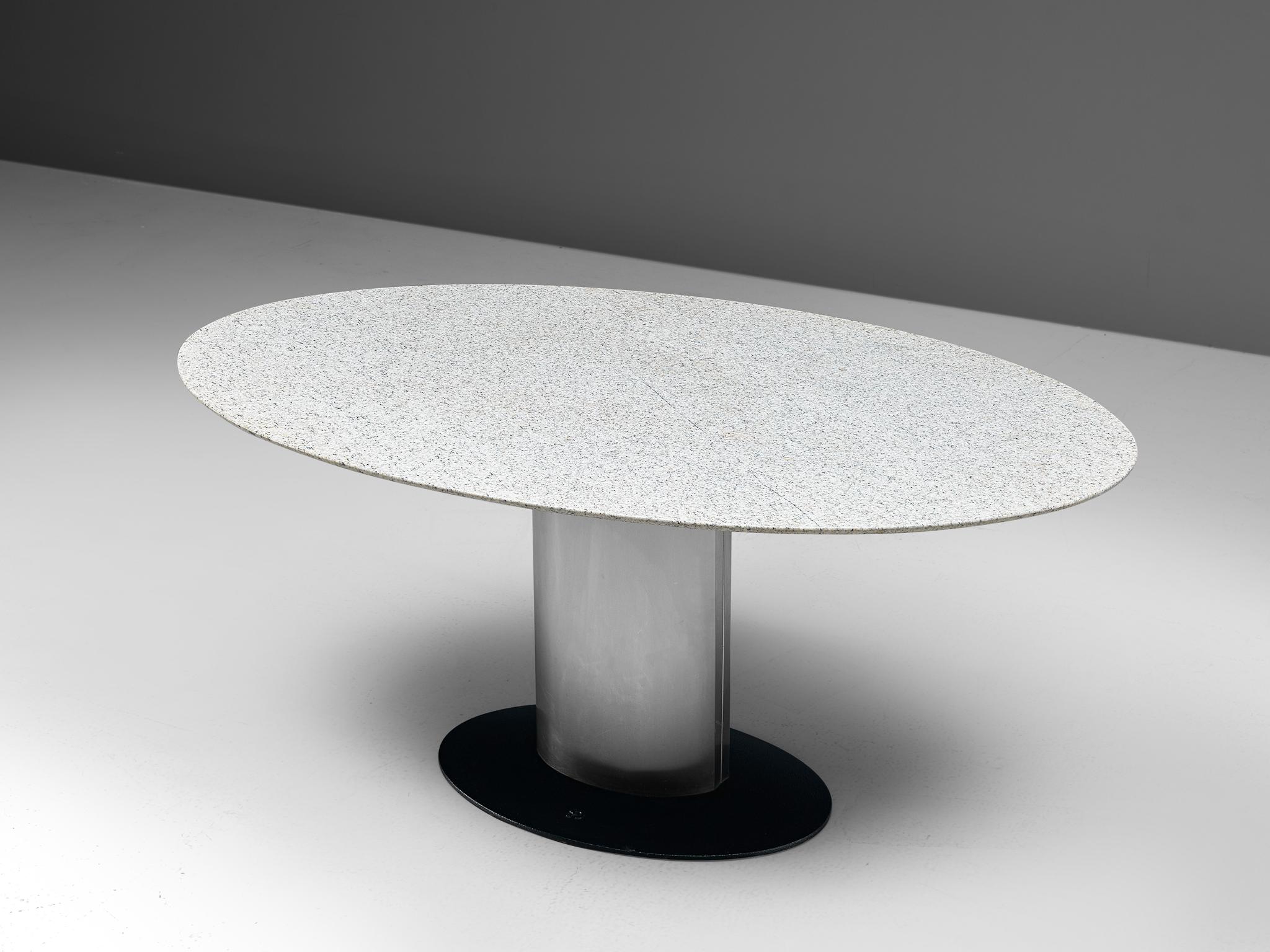 Pedestal table, white granite, metal, coated metal, Germany, 1970s

The oval shaped marble top of this table is a striking combination with its stainless steel pedestal base. The black lacquered foot following the metal base creates a light and
