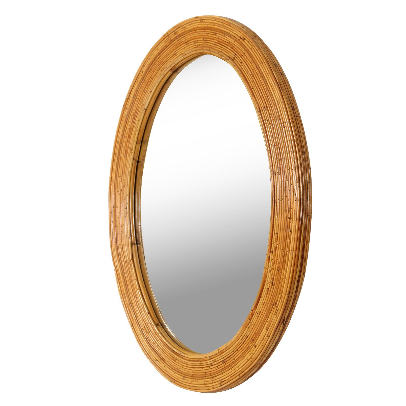This unique oval shaped mirror with a pencil reed rattan frame has great color and character.  It's texture has a slight sheen to it, and is a great way to add a different color and material to a room.