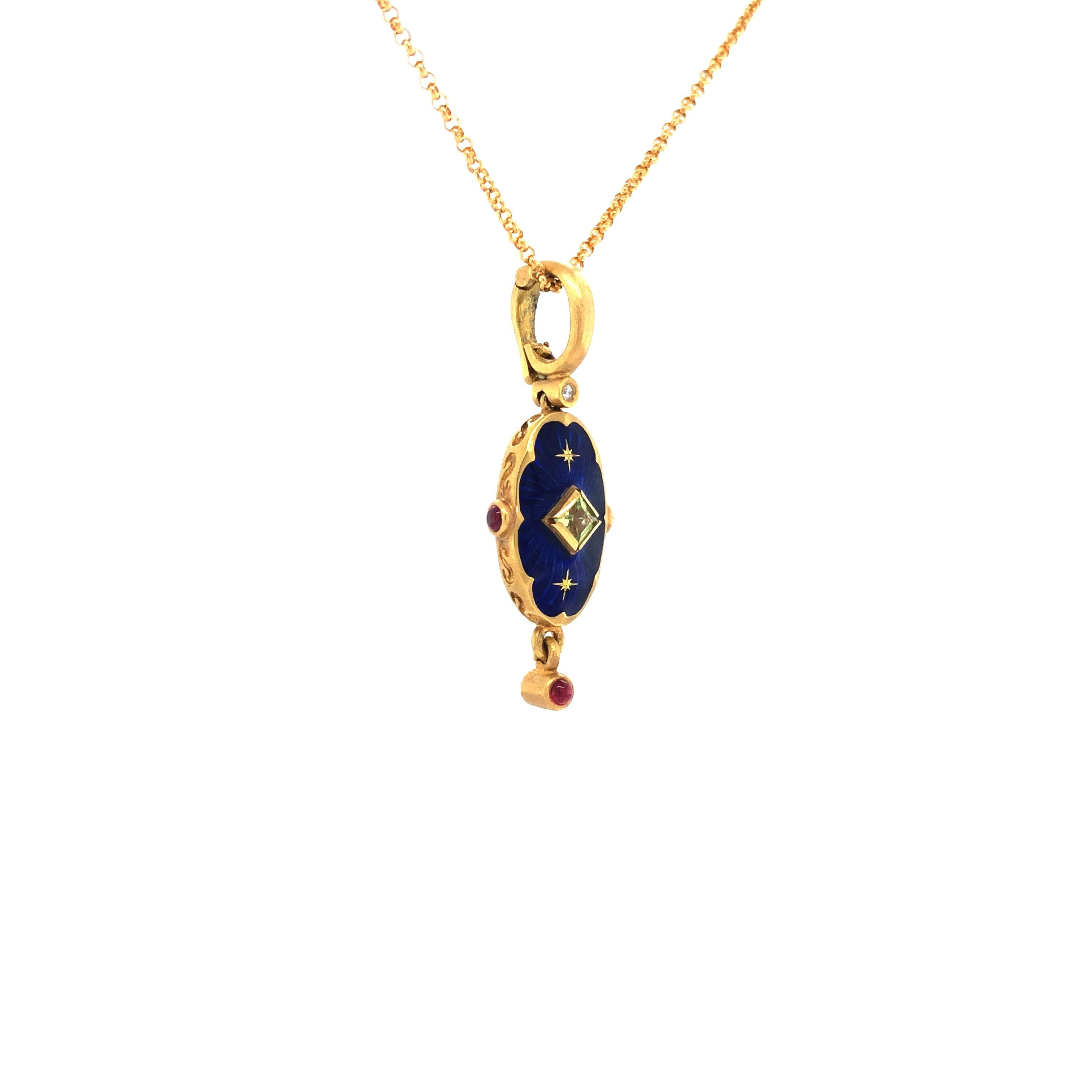 Victor Mayer oval pendant 18k yellow gold, blue Guilloche vitreous enamel, 1 Peridot, 3 Rubies, 2 Gold Star Paillons 

About the creator Victor Mayer
Victor Mayer is internationally renowned for elegant timeless designs and unrivalled expertise in