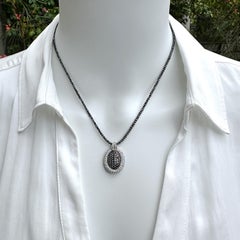 Oval Pendant with Reversible Black & White Diamond Center on Black Diamond Chain