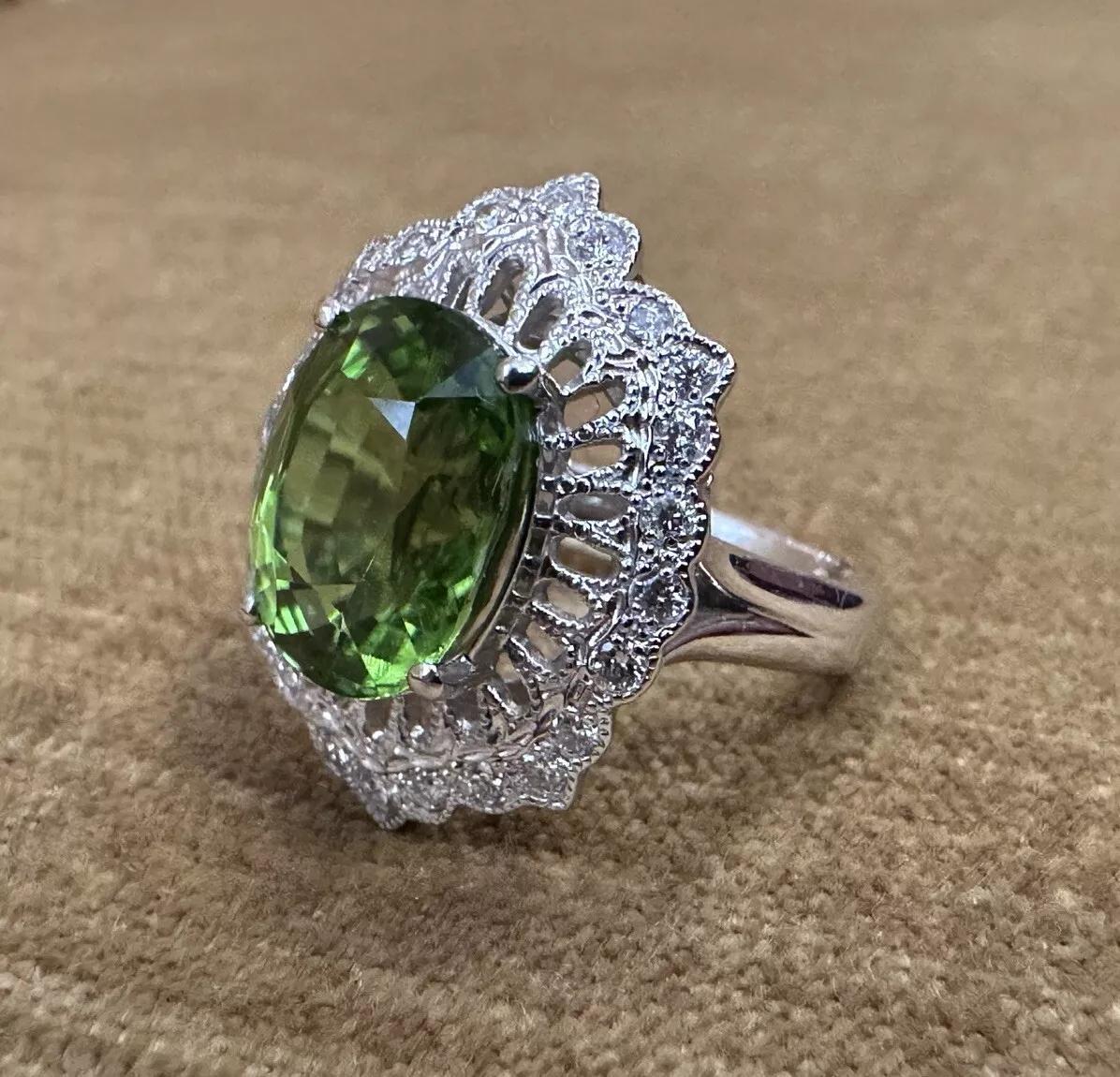 Oval Cut Oval Peridot 7.39 carat and Diamond Cocktail Ring in Platinum For Sale