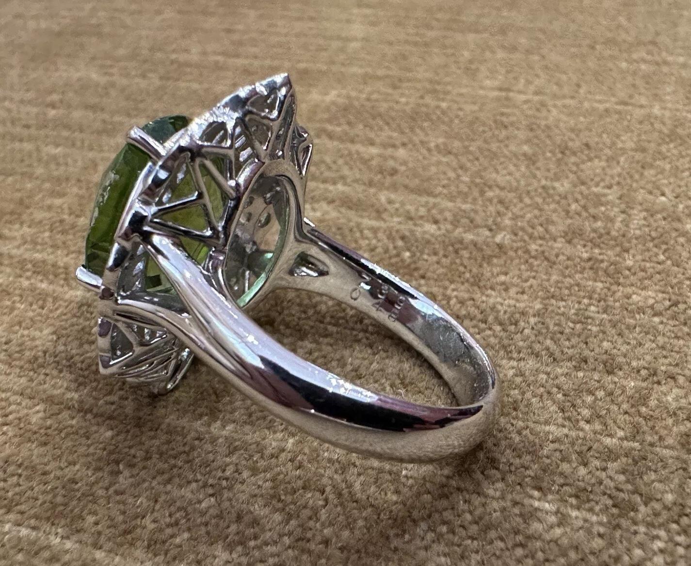 Women's Oval Peridot 7.39 carat and Diamond Cocktail Ring in Platinum For Sale
