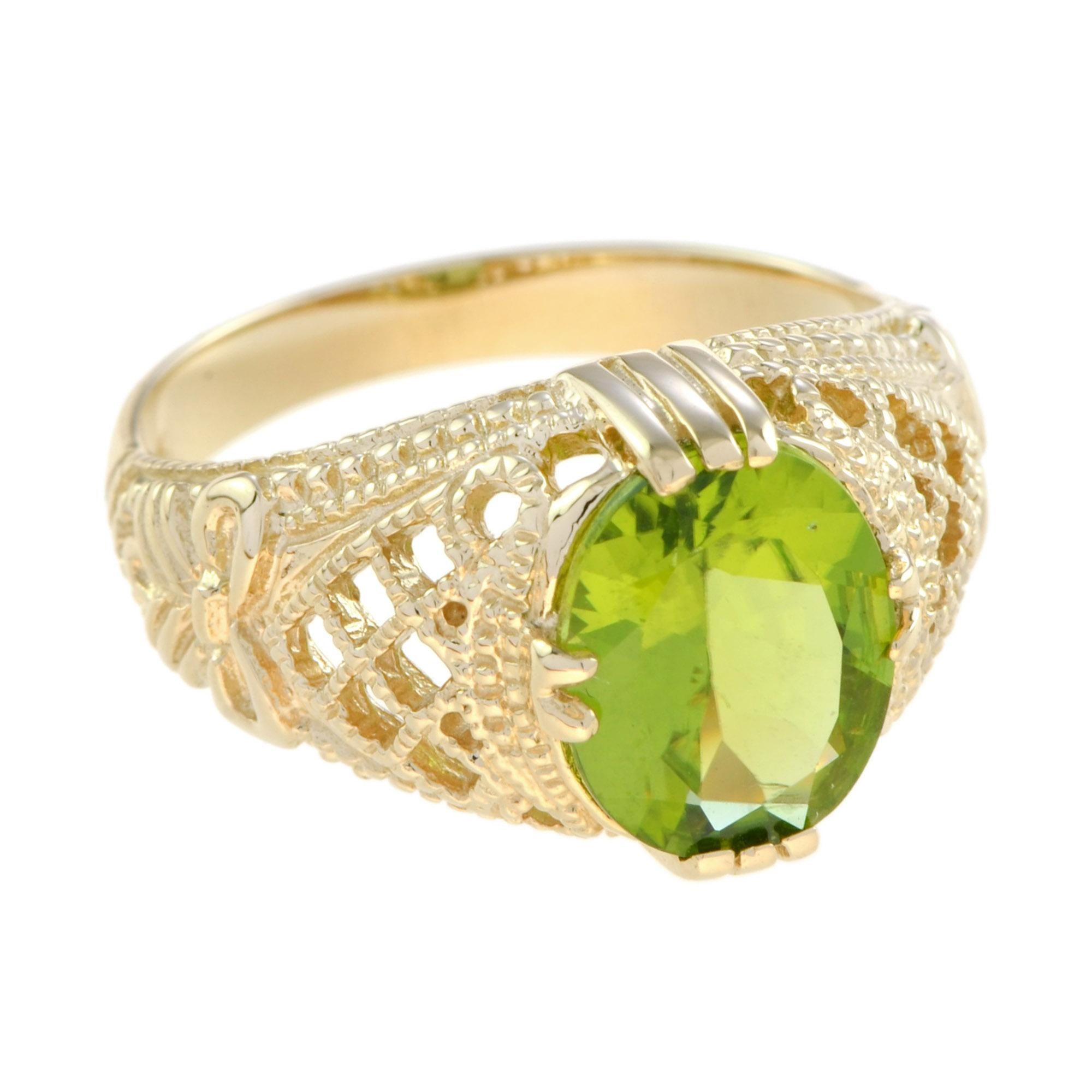 This gorgeous Edwardian filigree design peridot statement ring in 14k yellow gold showcases a large faceted shimmering beautiful oval natural peridot of 2.57 carats in a secure claw prong setting. This wonderful peridot cocktail ring is sure to