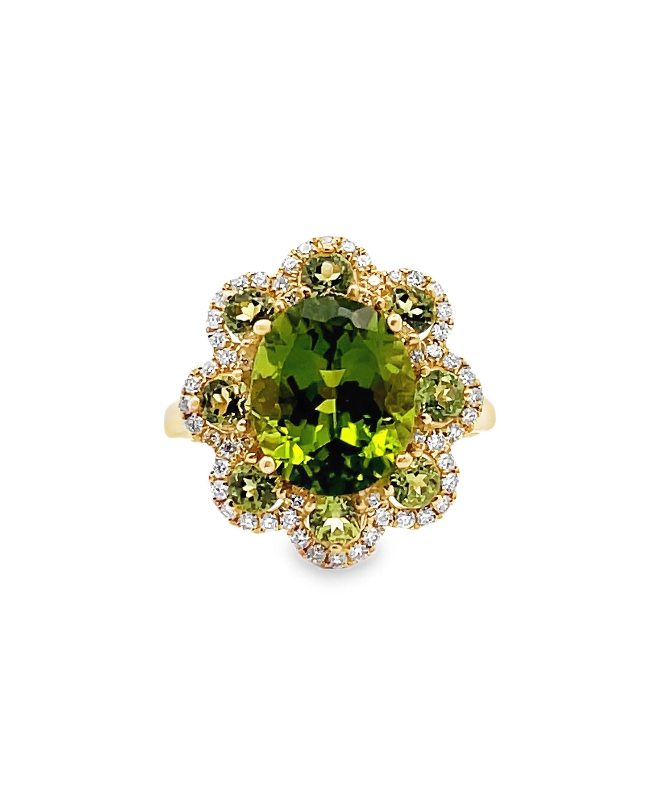14K yellow gold flower ring with diamonds at the outer most edges weighing 0.32 carat total and peridots weighing 4.94 carats total.

- Size 7
- Can be sized larger or smaller by up to two sizes