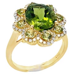 Oval Peridot Flower Ring in 14K Yellow Gold with Diamonds