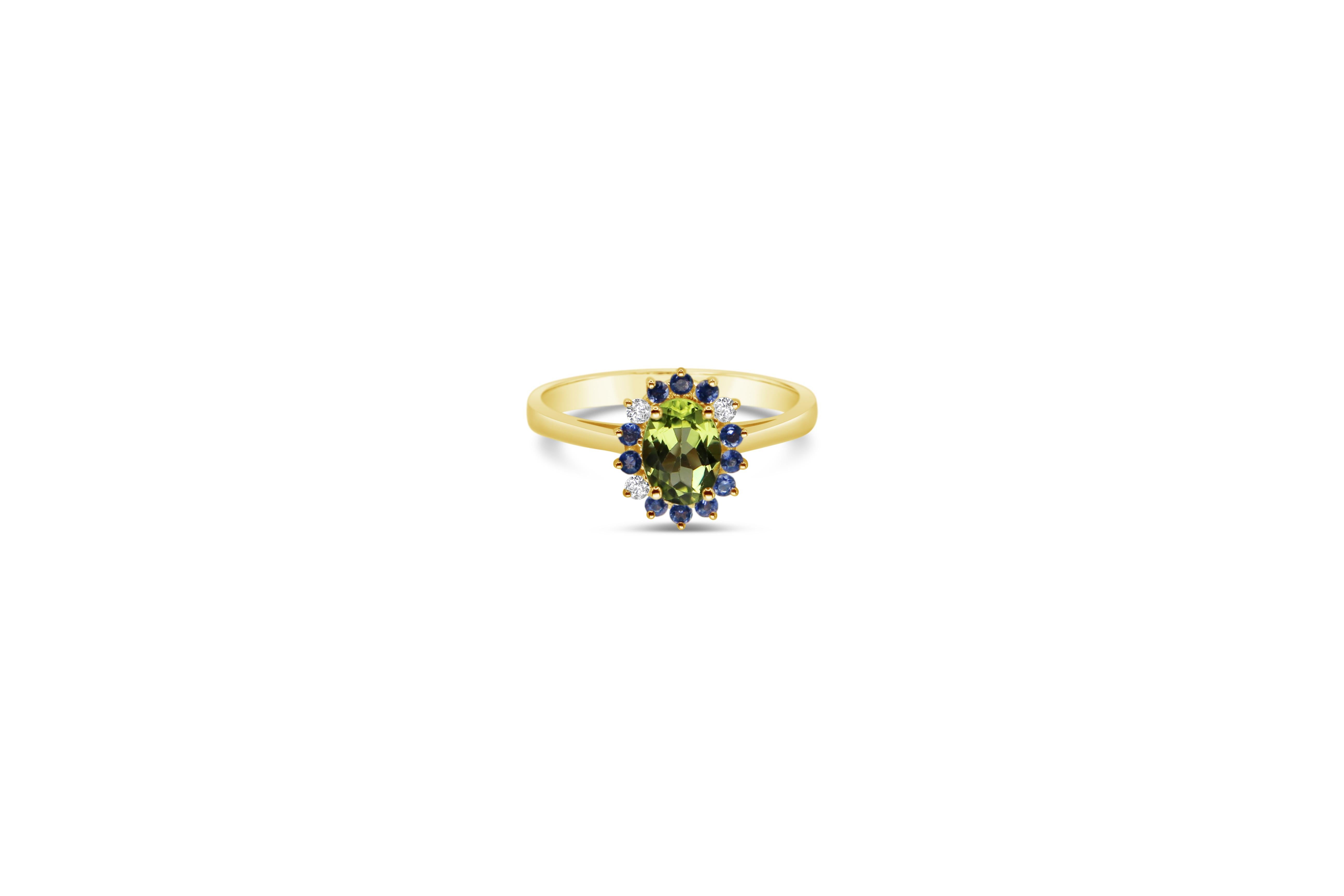 Oval Green Peridot  and blue Iolite  Cluster Ring in 18 carat Yellow Gold with random brilliant cut Diamonds 
A handcrafted ring, in 18Kt yellow gold. 
A delicate, modern and stylish piece of jewelry that never goes out of fashion and its wearable