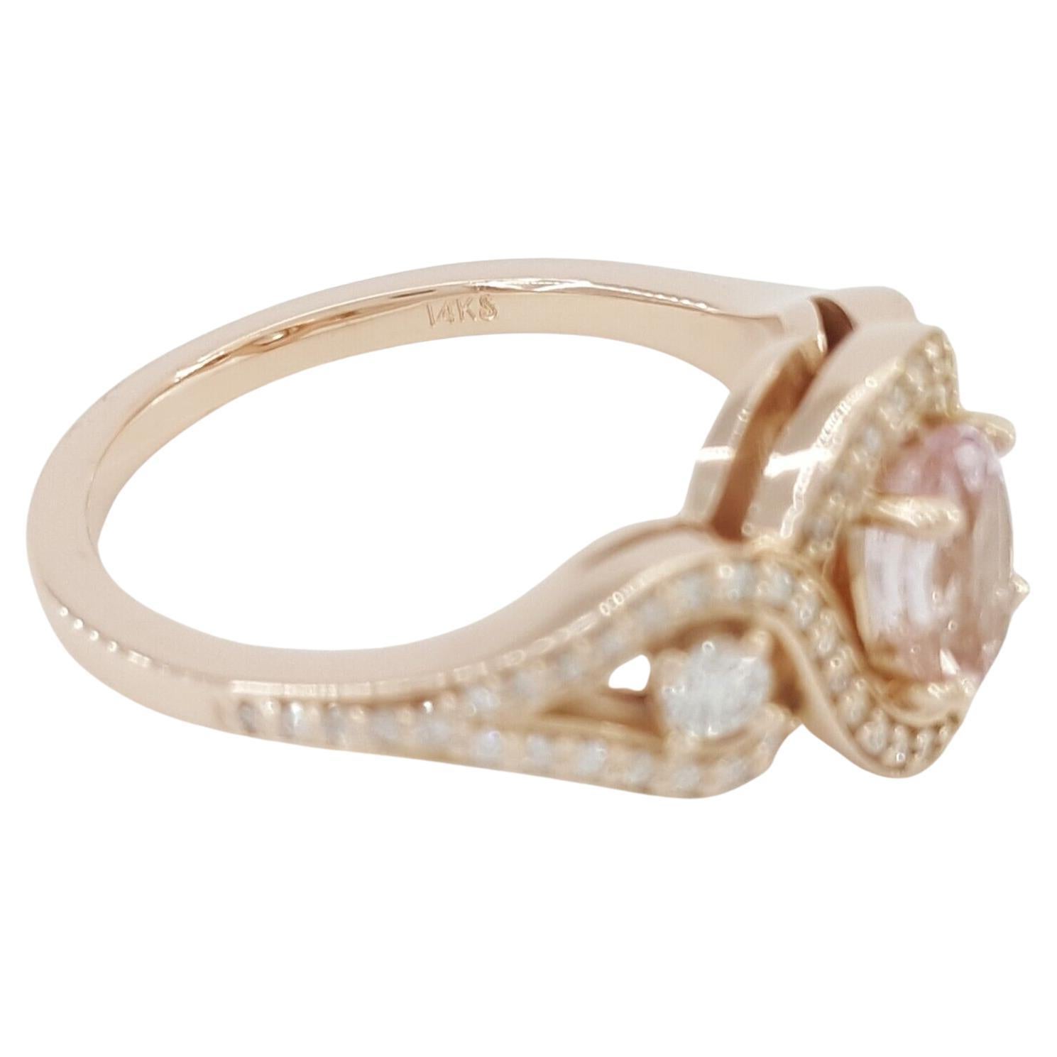 Introducing an exquisite engagement or statement ring, a symbol of elegance and timeless beauty. This piece is a stunning combination of a delicate pink morganite and dazzling diamonds set in a sophisticated design.

Key Details:
- The ring features