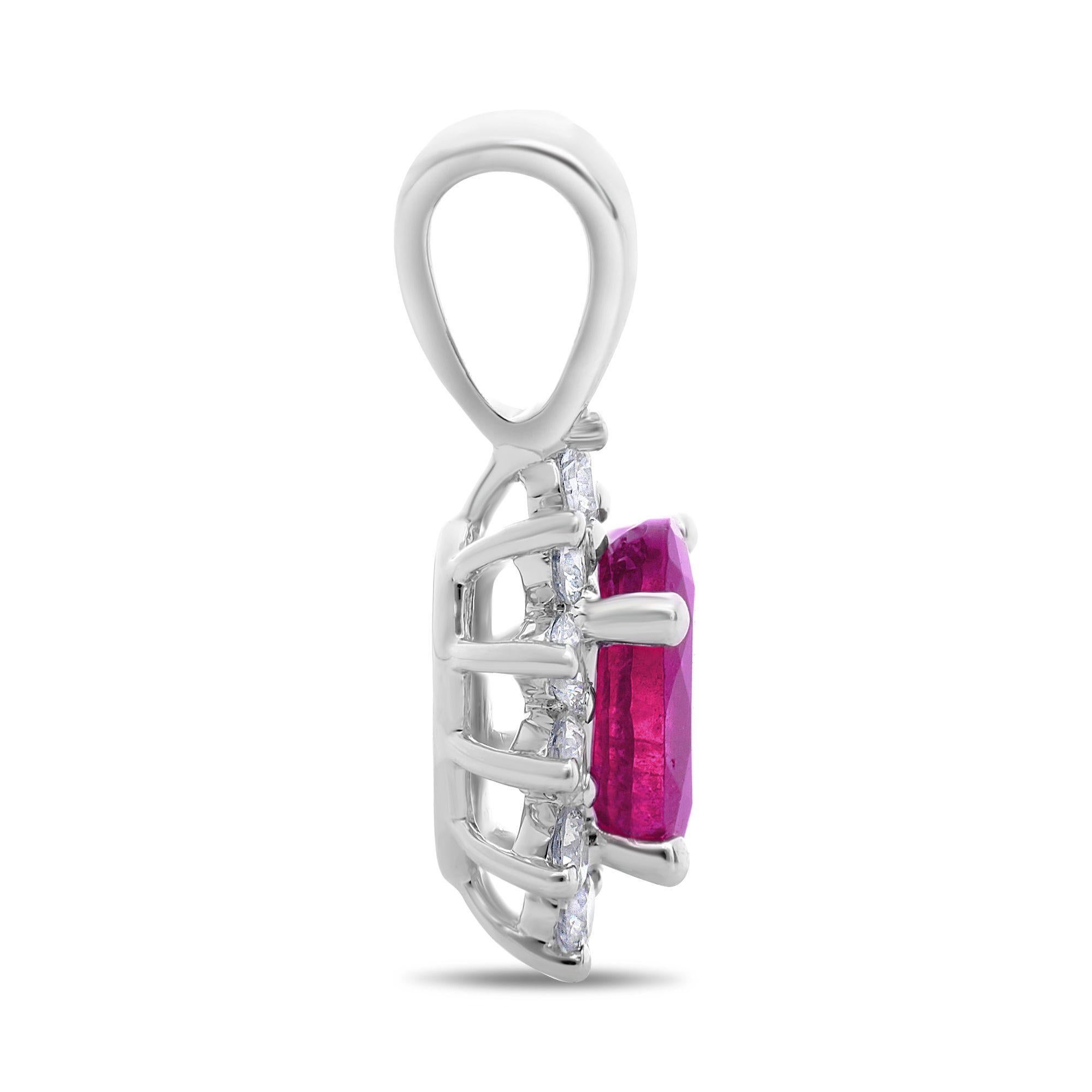 This 18 karat white gold pendant showcases a 0.63 carat, oval cut pink sapphire at the center. The colorful center stone is accentuated by 0.18 carats of round cut white diamonds, showcased in a stunning single halo. 

The center stone is eye clean