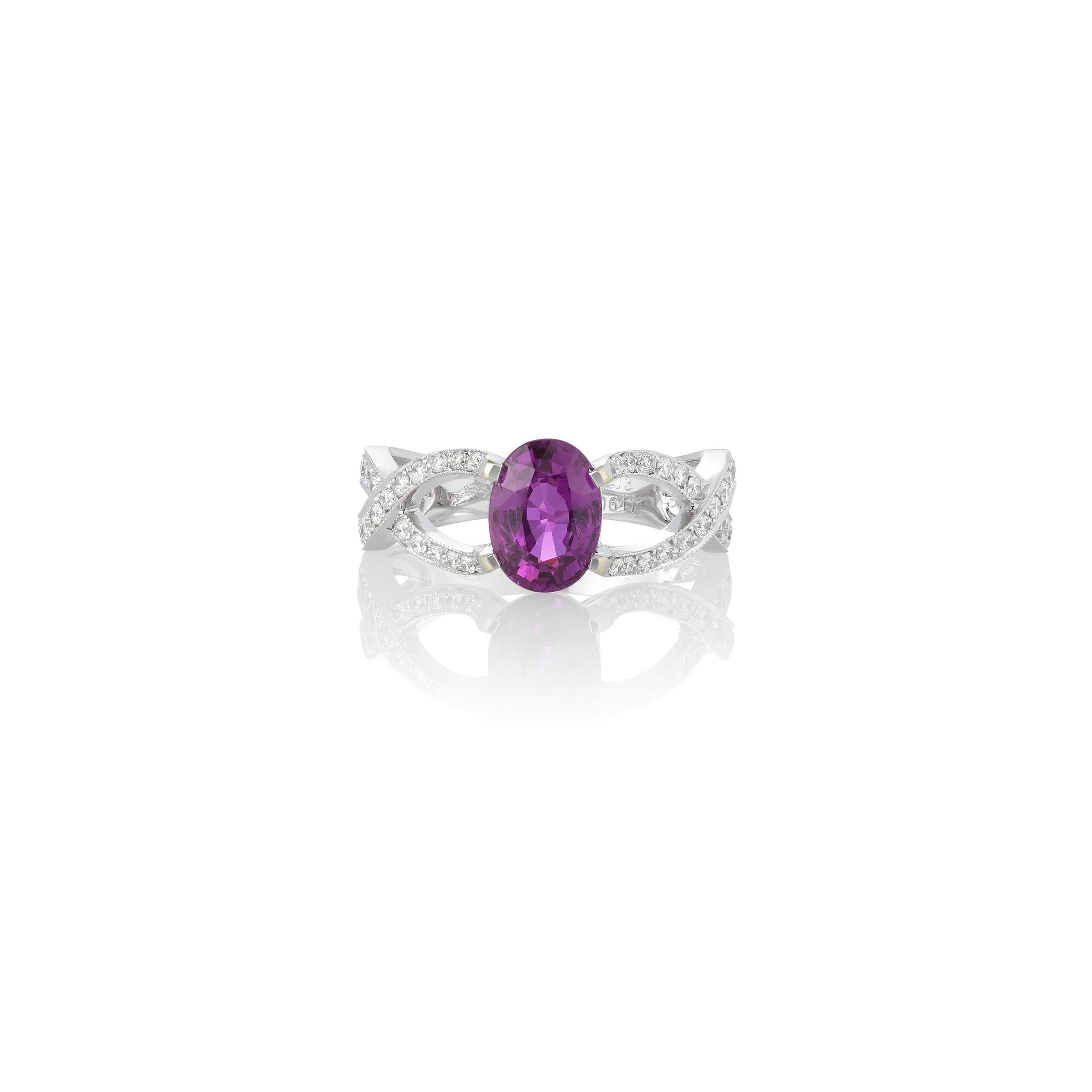 18K White Gold 2.03CTW Oval Pink Sapphire Ring with 0.65CTW Round Accent Diamonds. Designed by color Sapphire specialist, Michael Couch & Associates, this ring beautifully showcases the vibrancy of the pink center Sapphire. The ring is currently a