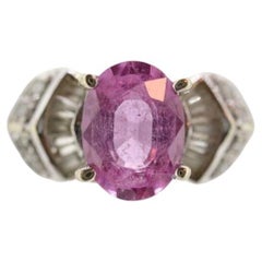 Oval Pink Sapphire Solitaire. 14k white gold with diamond melees