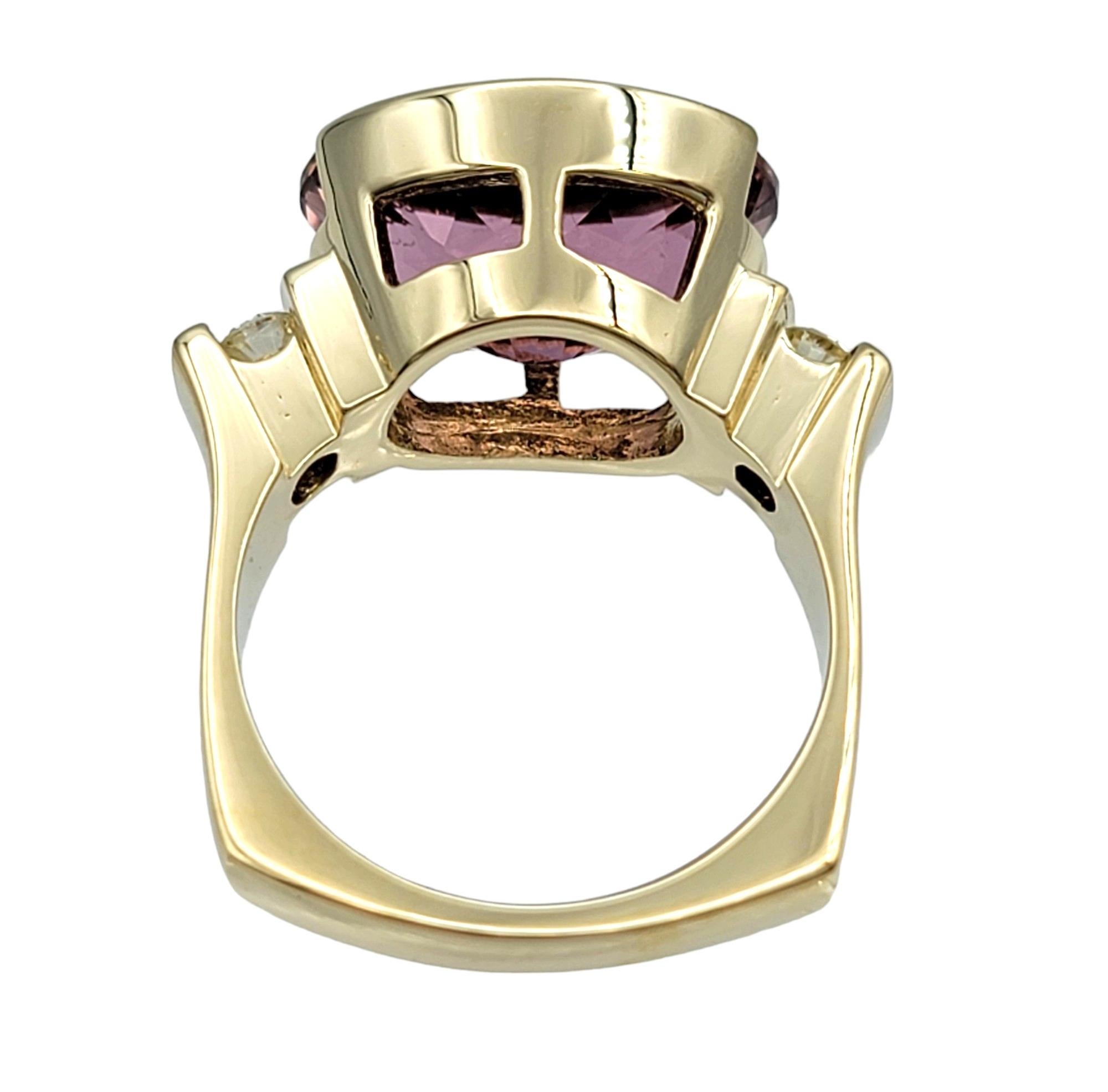 Contemporary Oval Pink Tourmaline and Round Diamond Cocktail Ring Set in 14 Karat Yellow Gold For Sale