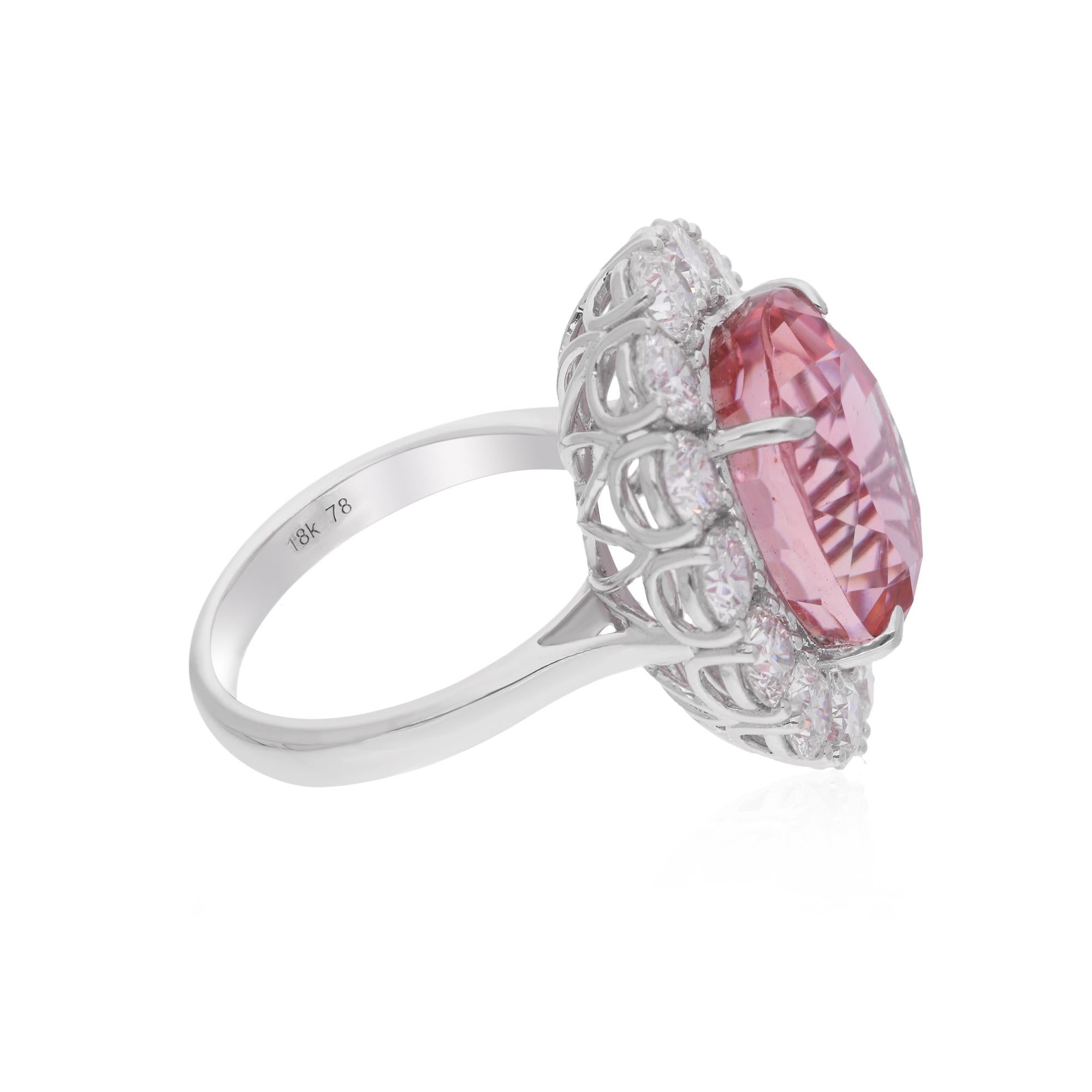 Elevate your style with the enchanting sophistication of this Oval Pink Tourmaline Gemstone Cocktail Ring, accentuated with dazzling Diamonds and expertly crafted in 14 Karat White Gold. This striking piece of jewelry is a celebration of elegance