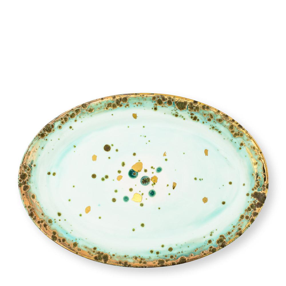 Hand painted in Italy from the finest porcelain, this Michelangelo oval plate is material and earthy, like the great Renaissance Master's work. It conveys classical beauty and elegance. The green enameled shade fades as it moves away from the rim