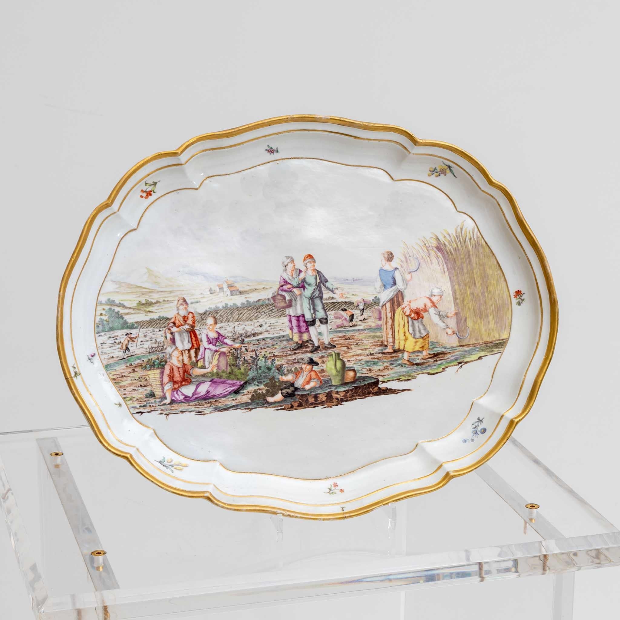 Oval plate with harvest scene, Nymphenburg, c. 1770-75, pressed mark Rautenschild, incised 44, painting attributed to Joseph Kaltner. Prov.: Collection Dr. Paul von Ostermann, Darmstadt-Munich, auctioned Cassirer/Helbing 1928, Lot 624; G. Röbbig,