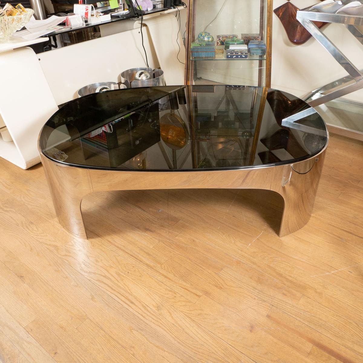 American Oval polished stainless steel black glass coffee table For Sale