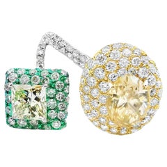 Anillo de oro blanco de 18k con diamante oval y princesa