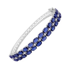 Bracciale ovale con zaffiro lavorato e diamanti naturali in oro bianco 14 carati