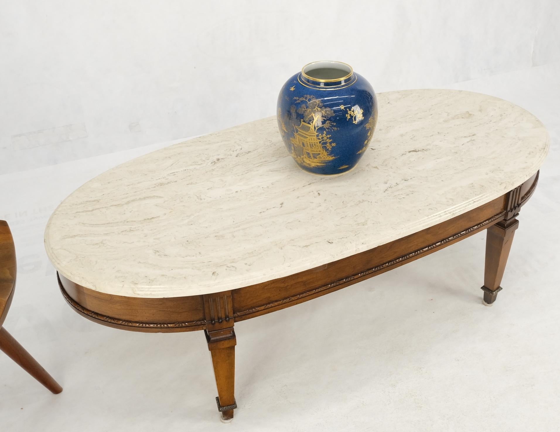 Oval racetrack shape marble top mahogany Federal style coffee table.