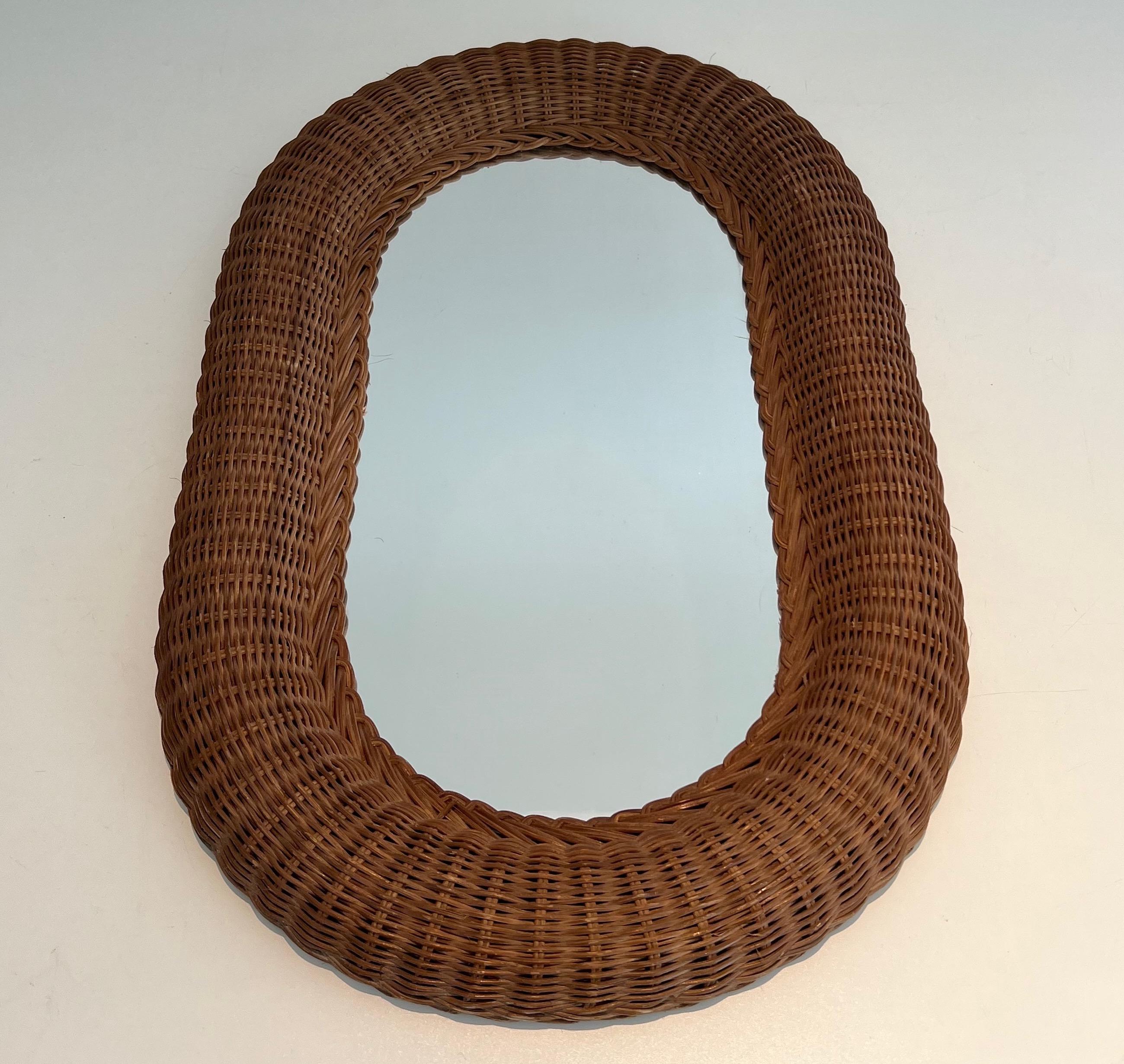 Mid-Century Modern Oval rattan mirror. French work. Circa 1970 For Sale