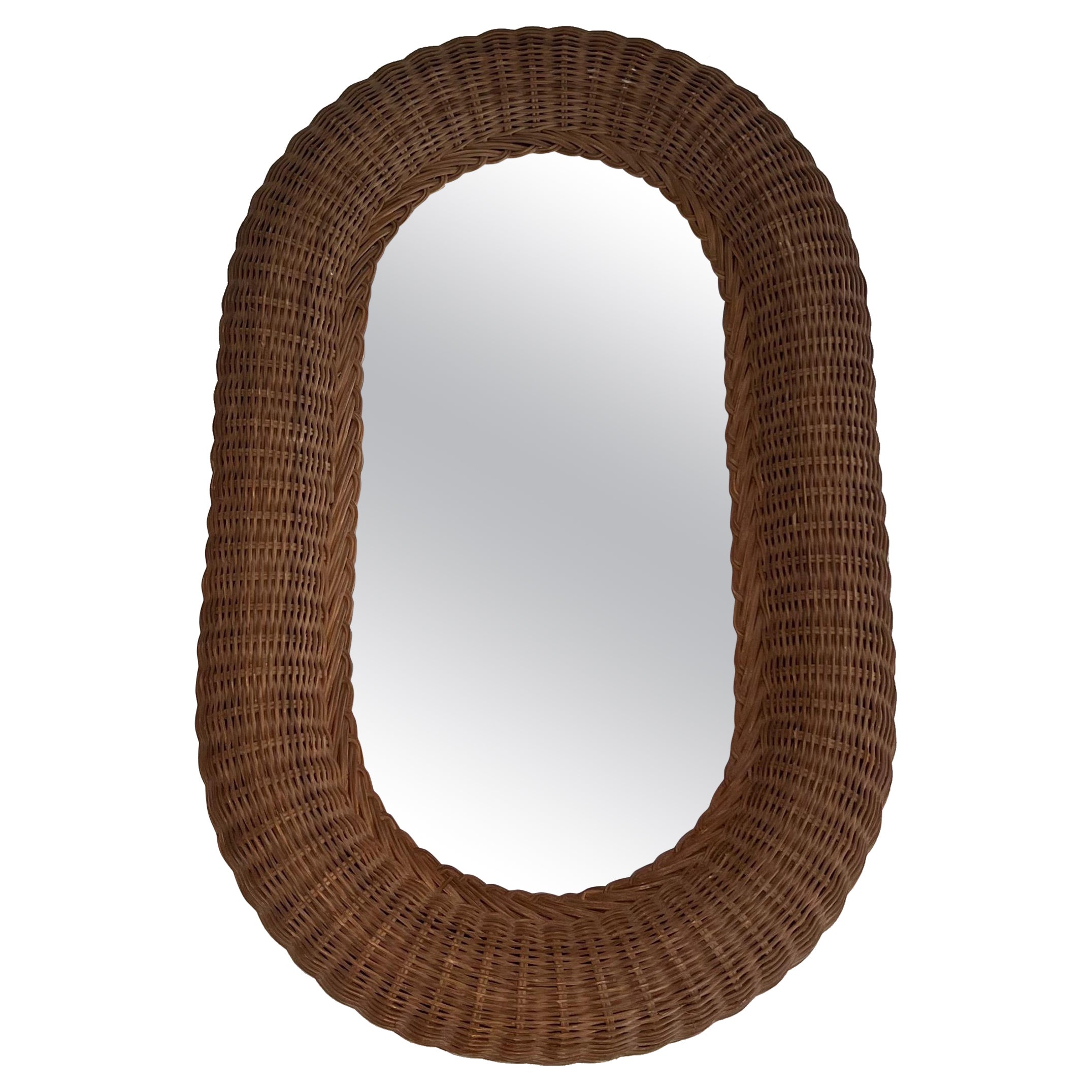 Specchio ovale in rattan. Lavoro francese. Circa 1970