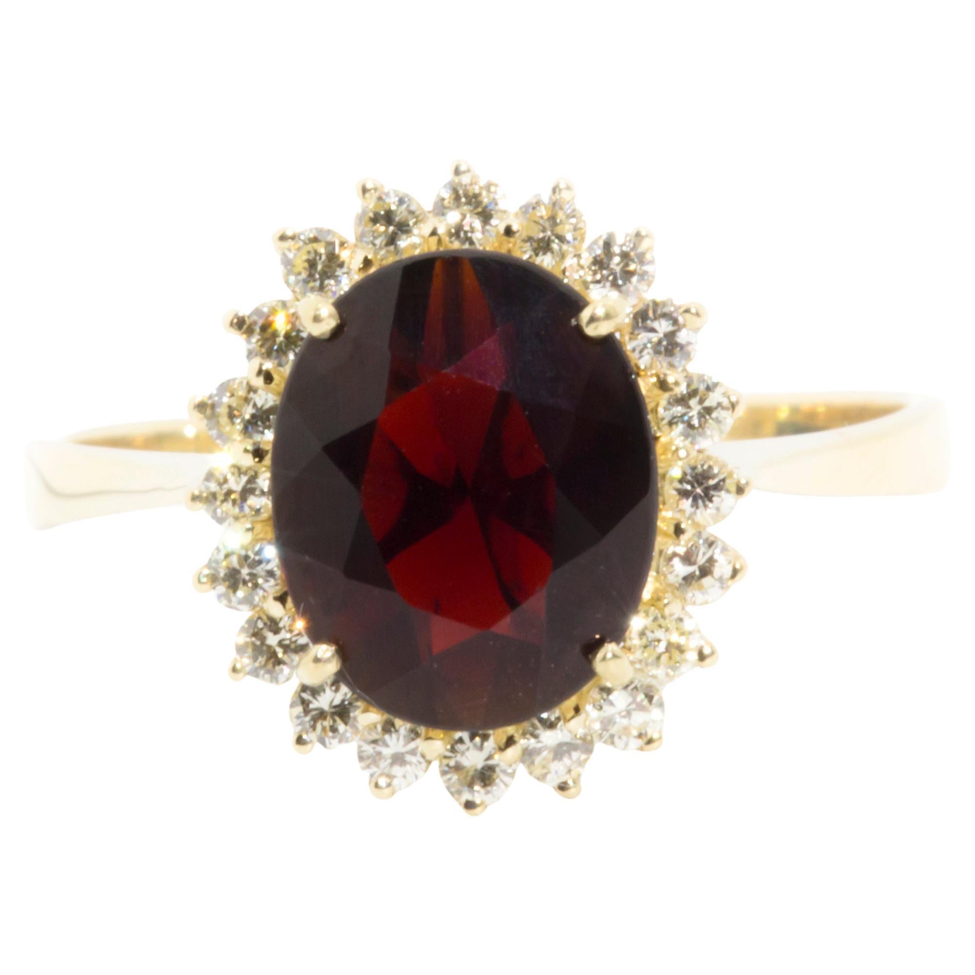 Oval Red Garnet and Diamond Vintage Halo Cluster Ring in 14 Carat Yellow Gold