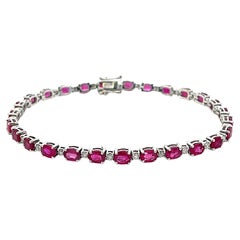 Oval Red Ruby and Diamond Tennis Bracelet in 14k White Gold