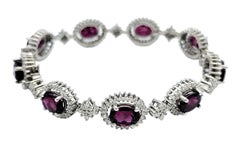 Pulsera de eslabones de granate rodolita ovalado y halo de diamantes en oro blanco de 14 quilates