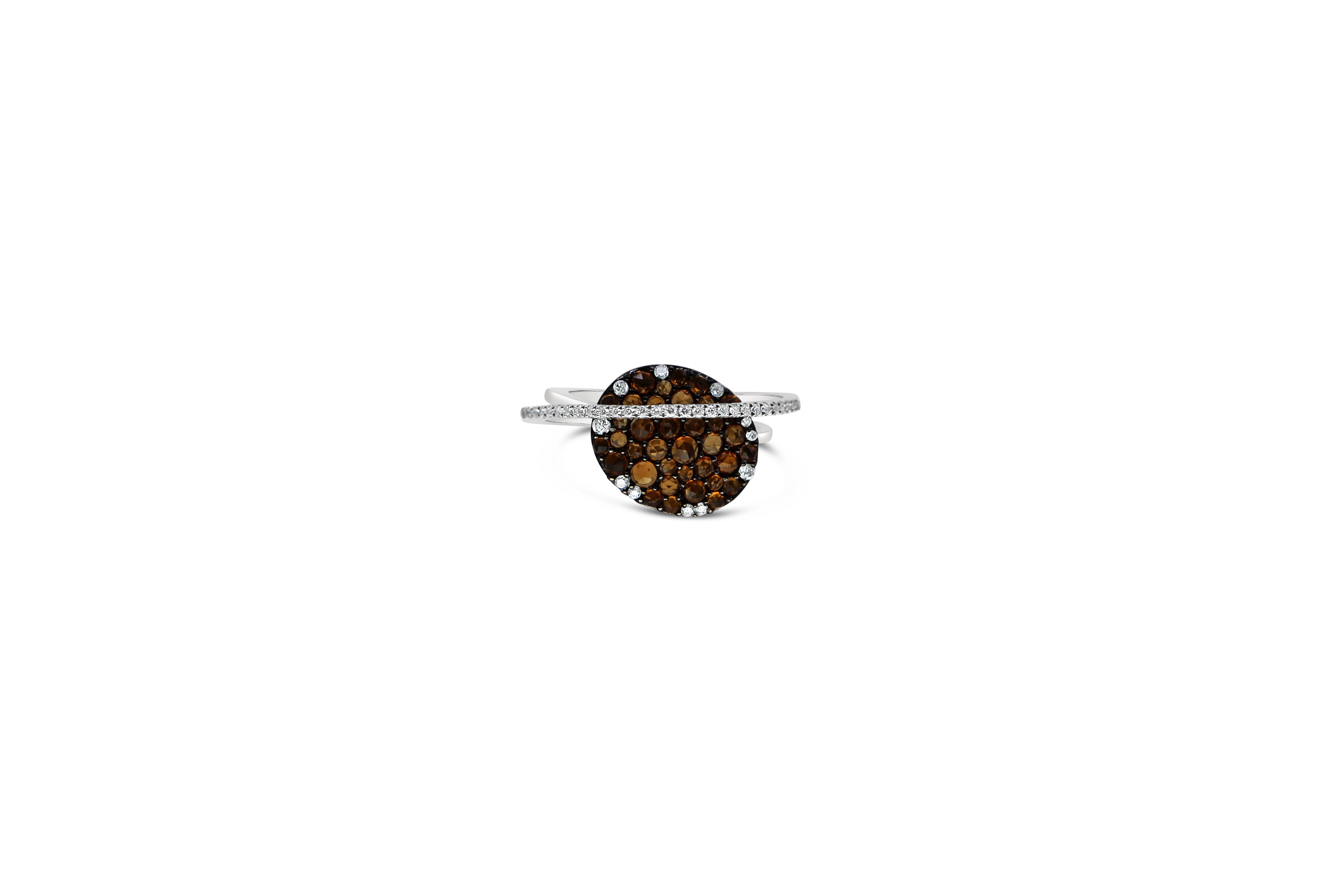 Oval Ring with Brown Diamond Old Cut, in 18Kt White Gold, with Double Diamonds Pave Shank 
The ring is handcrafted in 18Kt white gold. The center of the ring is set with brown old cut diamonds in snow pave setting  0.75ct and the white ones 0.2ct.