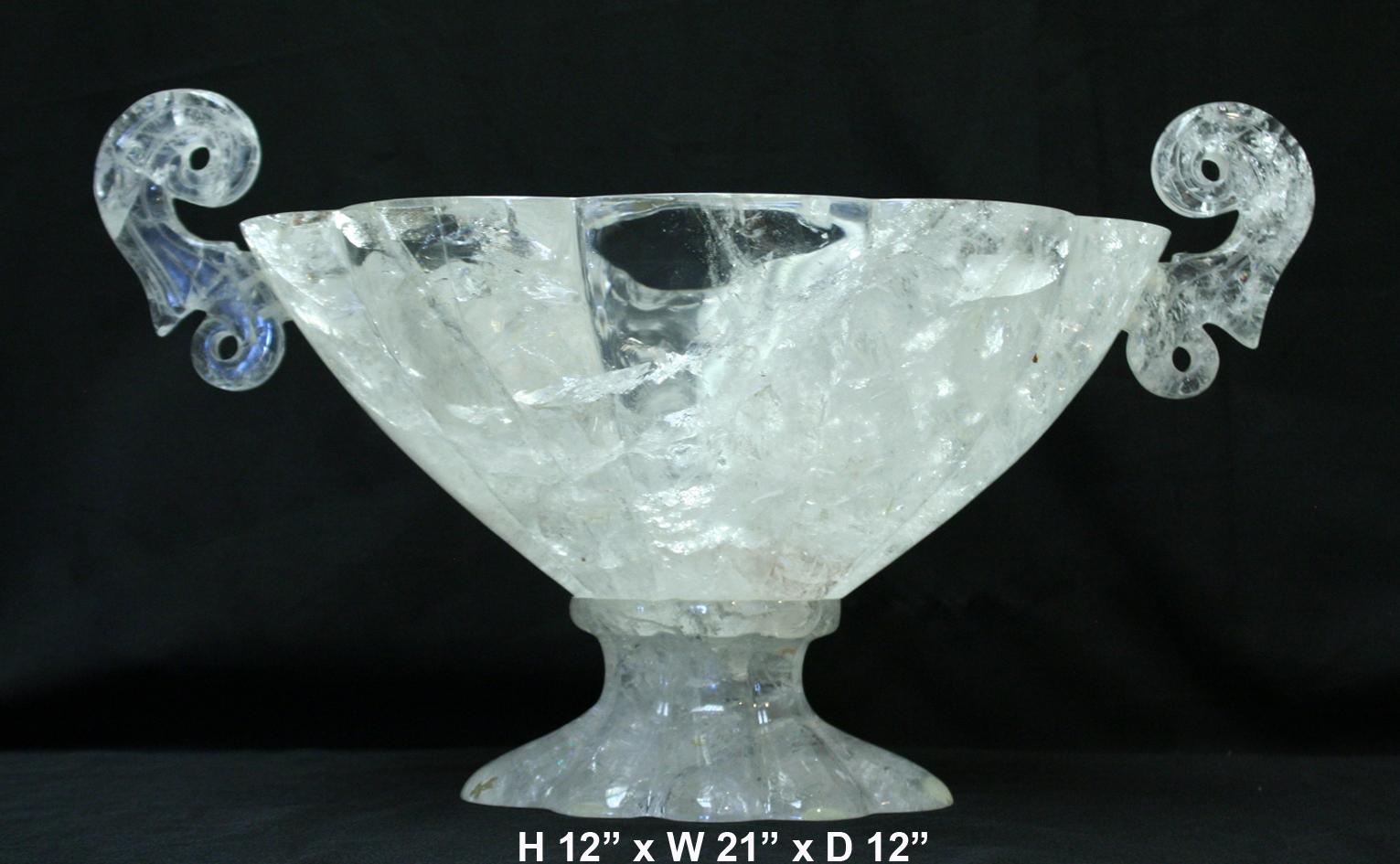 Exquisite large hand carved and hand-polished rock crystal oval centerpiece with curved handles.
The outside is hand carved scalloped motif.
Meticulous attention has been given to the carving and the quality.
Rock crystal centerpieces are