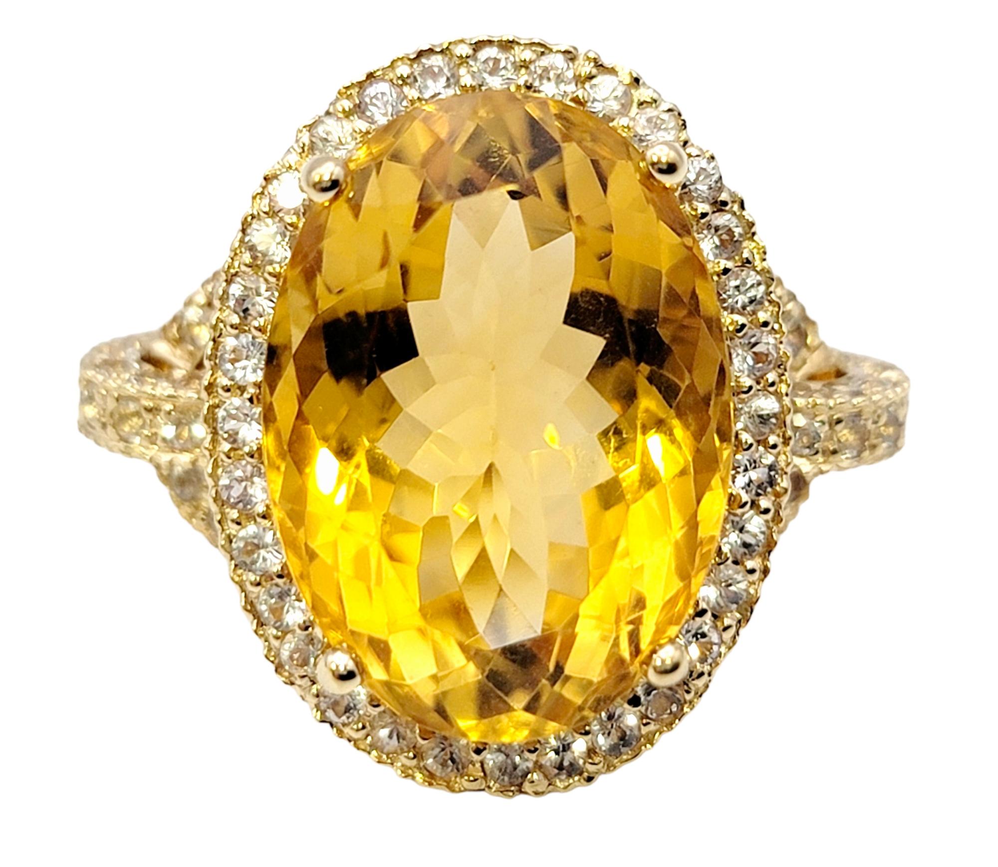 Ring size: 6

Absolutely gorgeous citrine and white sapphire halo cocktail ring. The striking orangish-yellow oval cut center stone is paired with a wide glittering halo of natural pave white sapphires, allowing this bold and beautiful piece to