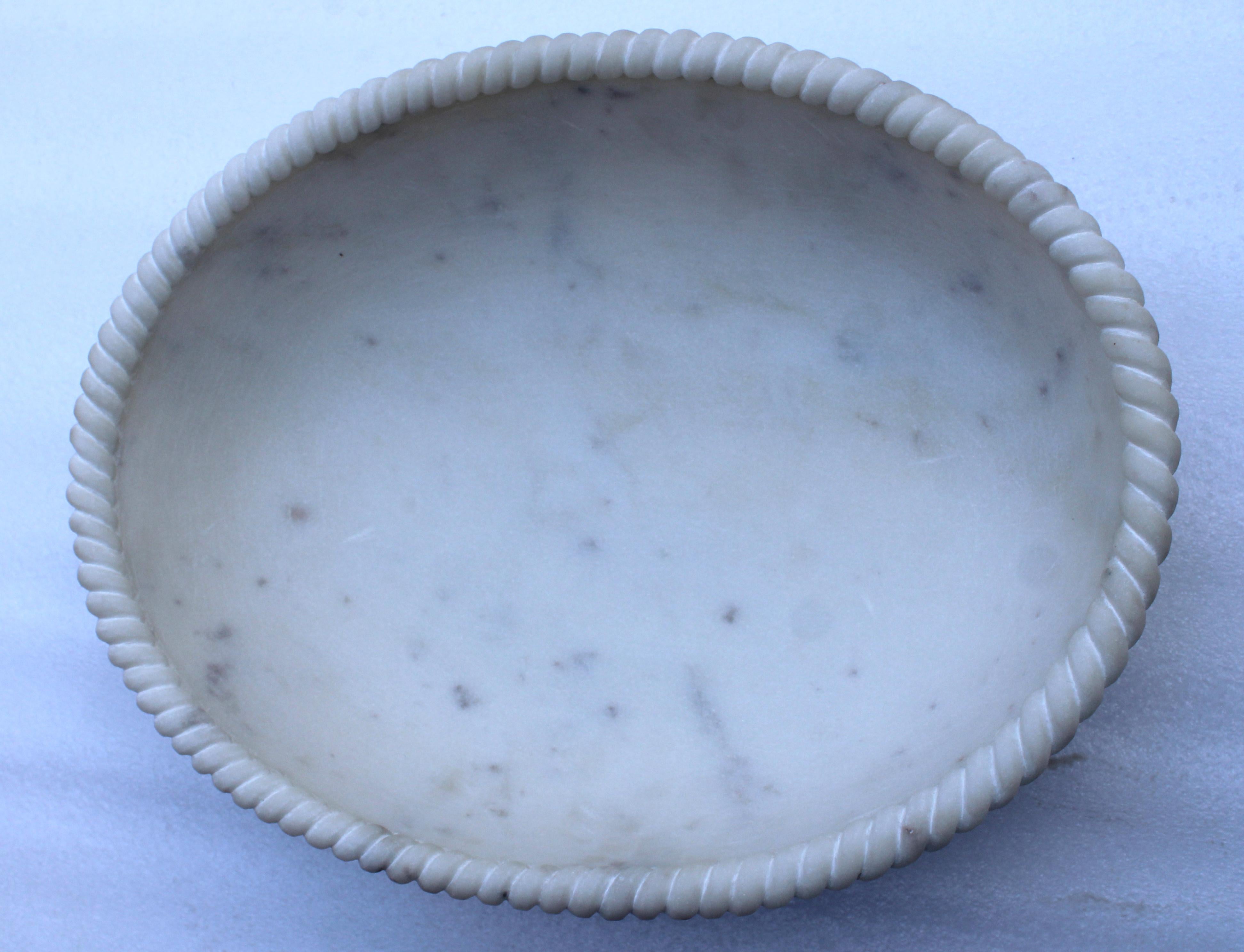 Sculpted out of a single block of marble with a delicately carved rope edge, perfect for a potpourri, a fruit bowl or just a key catch.


Oval Rope Bowl
Size- 14” x 11” x 4” H
Materials - Marble, Hand-Carved


Buyer Cancellation-
The cancellation