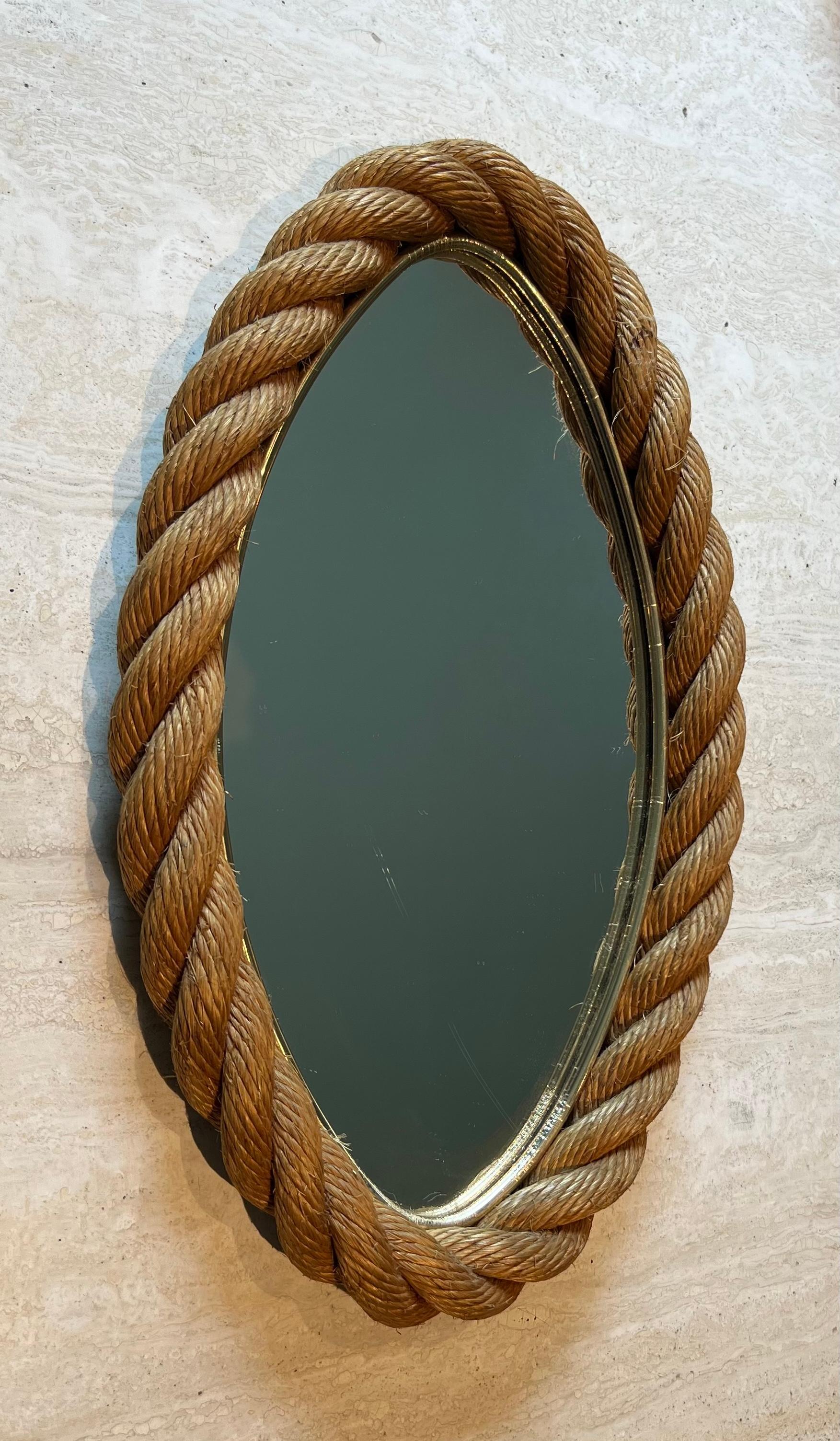 This nice oval mirror is made of rope. This is a French work by Adrien Audoux and Frida Minet (Audoux-Minet). Circa 1970
