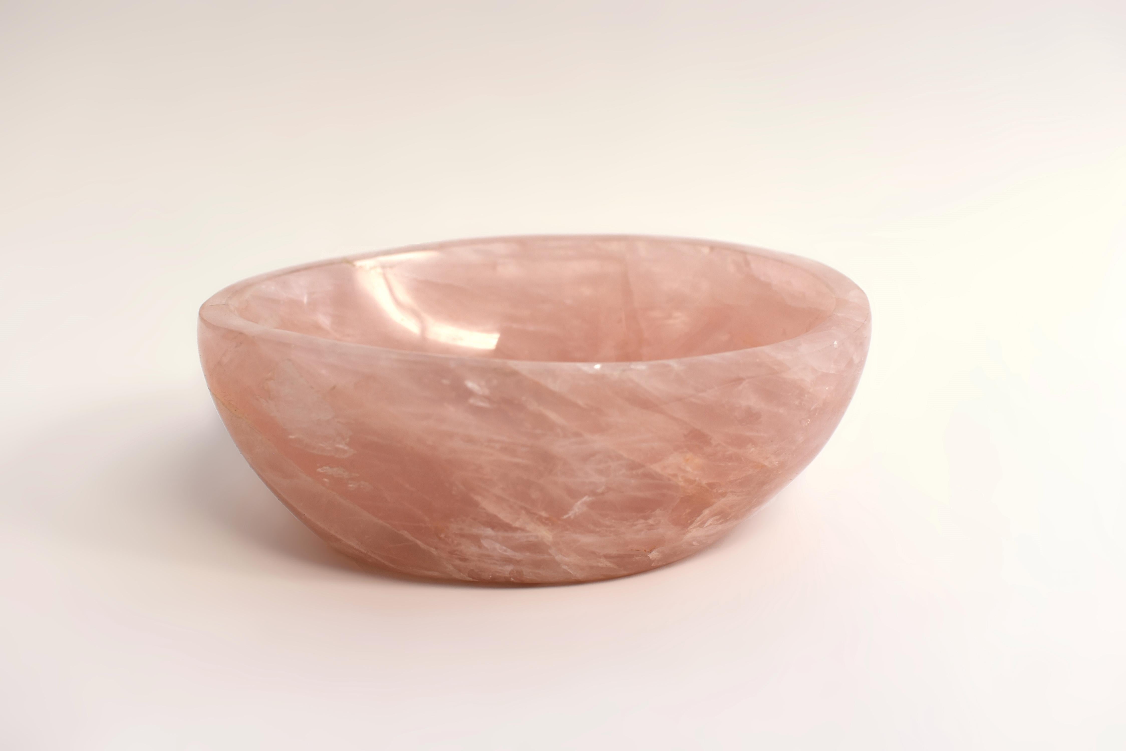 A beautiful large rose quartz bowl weighing 3.5 lbs. Of ovoid form with smooth edge and inside out, stone of the highest quality grade AAA rose quartz. All natural gemstone, hand crafted and polished. Stunning color and iridescence. Rose quartz is a