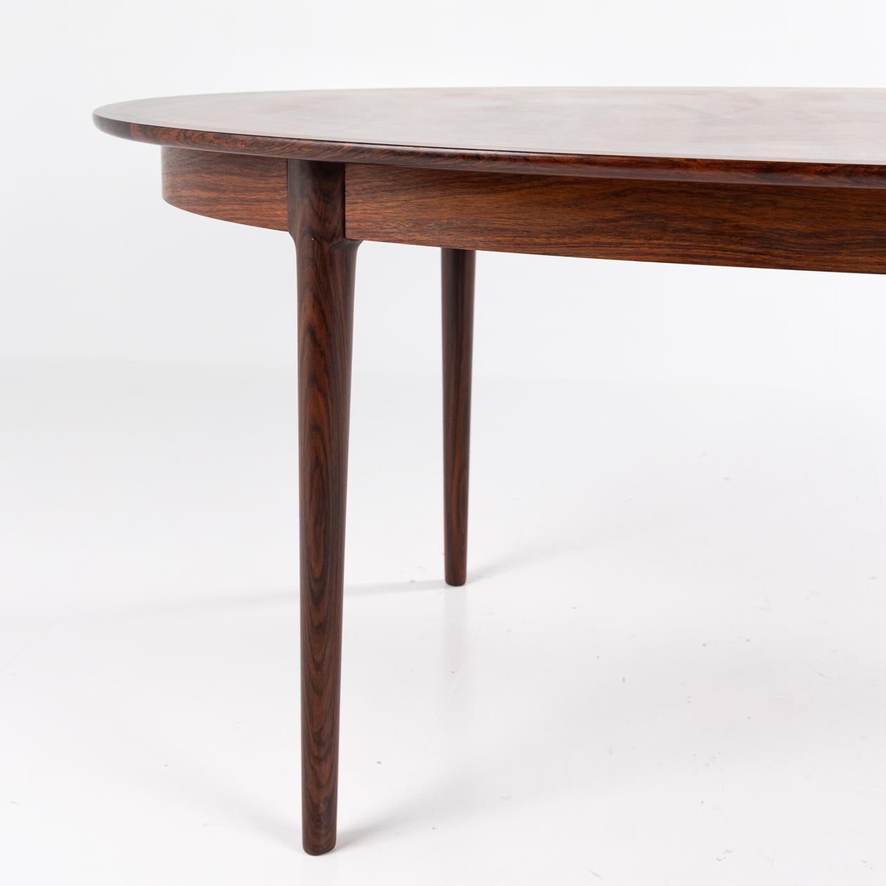 Patinated Oval rosewood dining table by Torbjørn Afdal