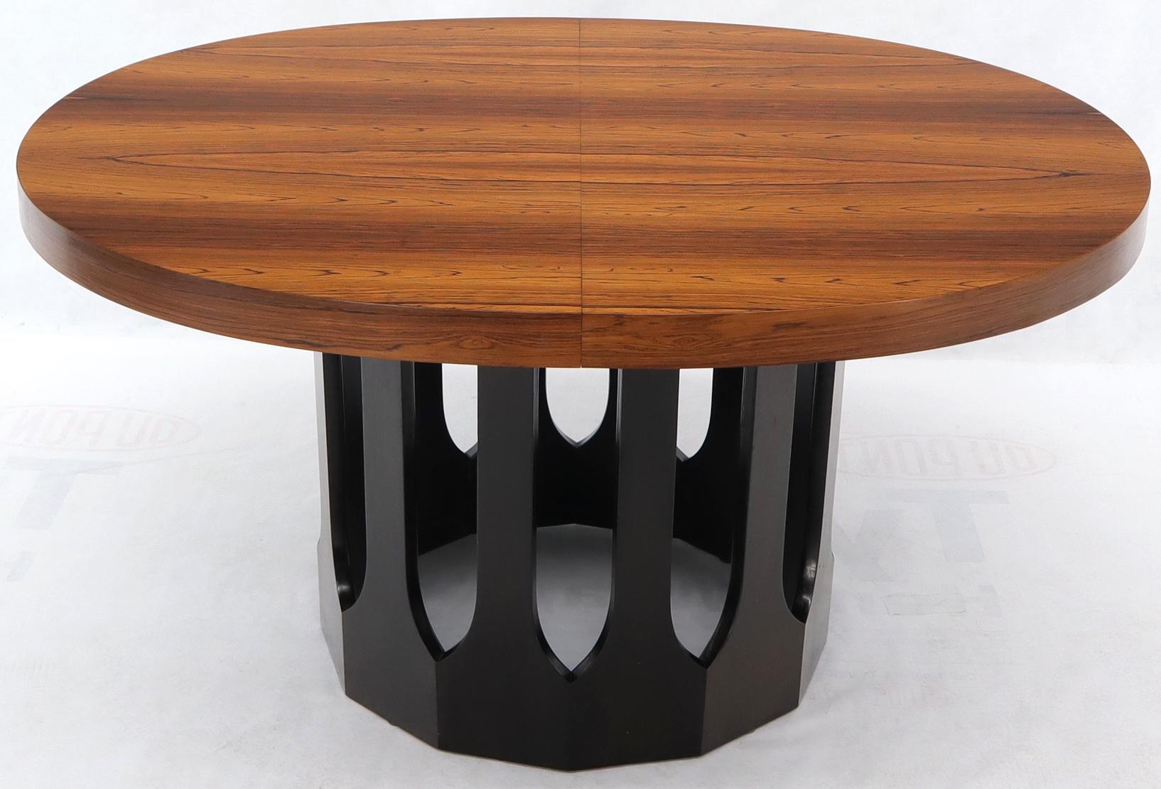 Stunning mint condition oval dining table by Harvey Probber that come with two 16