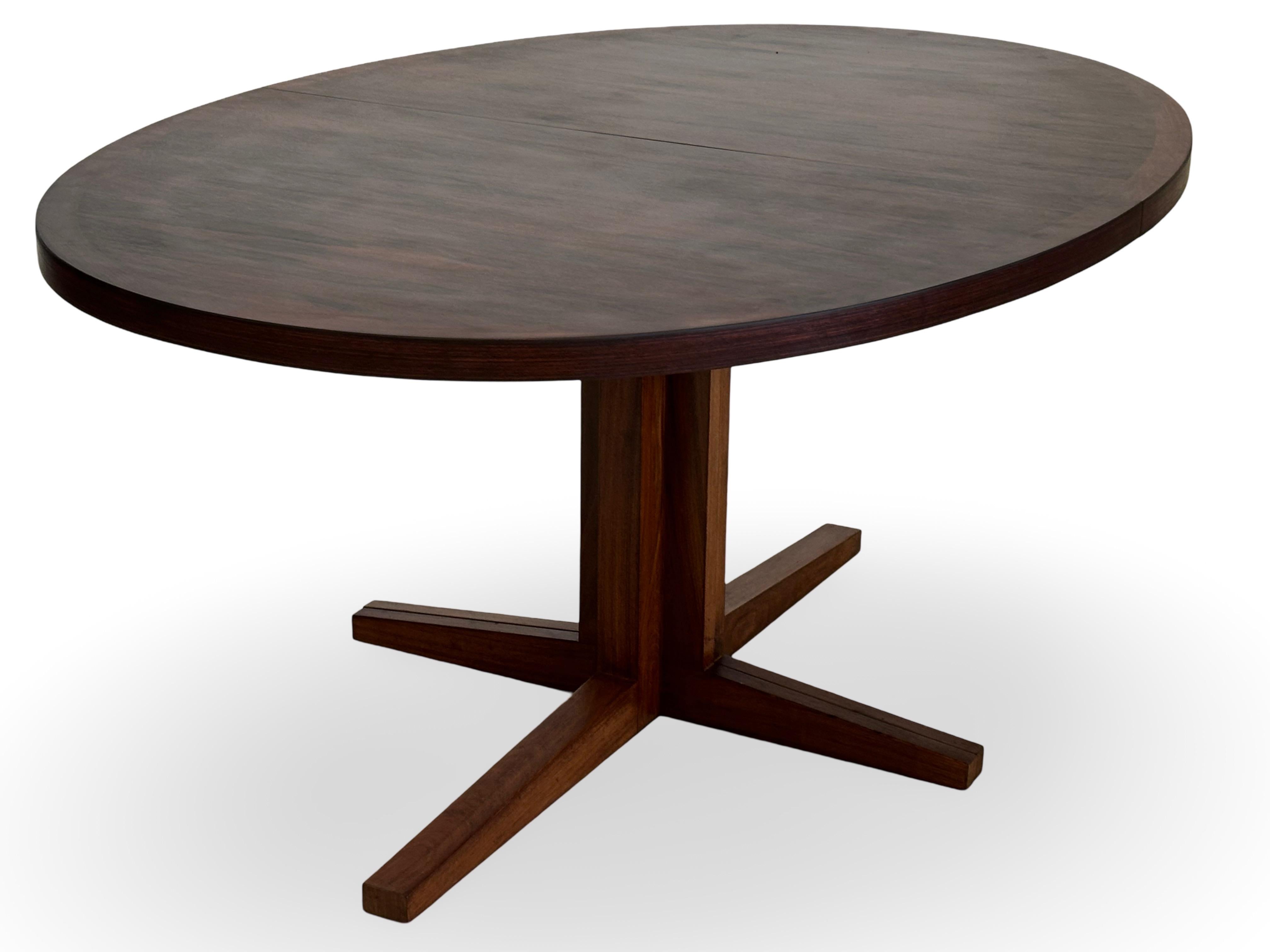 The medium model oval rosewood dining table with two extensions. Designed for Heltborg Møbler by John Mortensen, Denmark.
Max length is 263 cm.