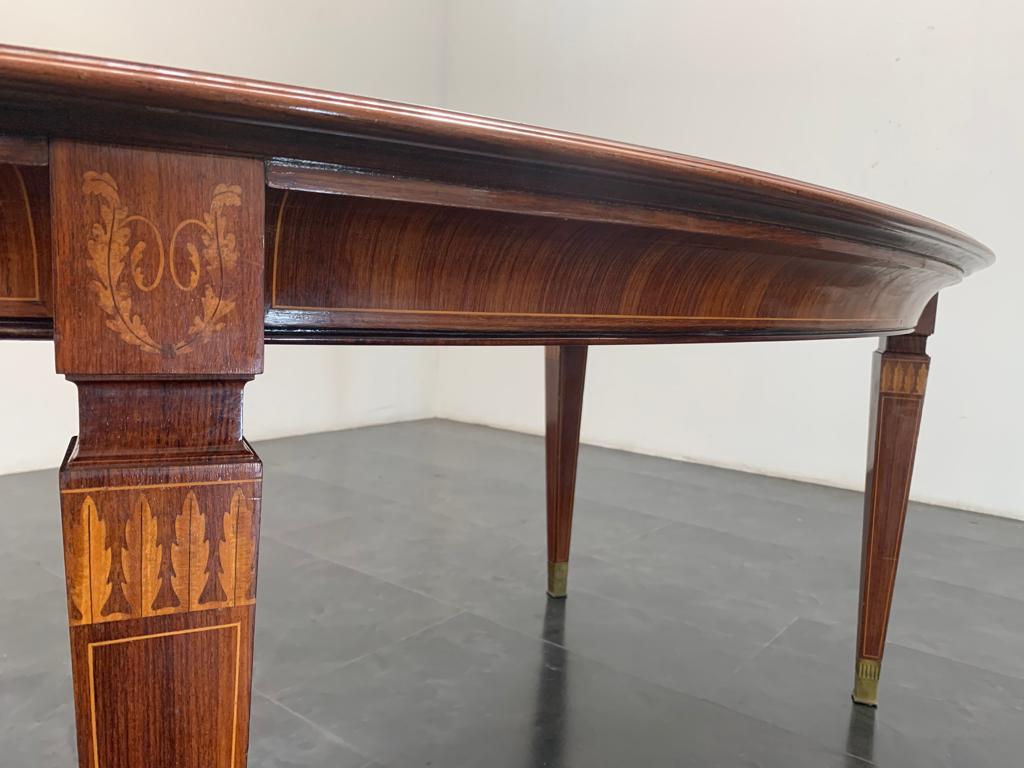 Laiton Table ovale en palissandre attribuée à Paolo Buffa pour La Permanente Cantù, années 1950 en vente