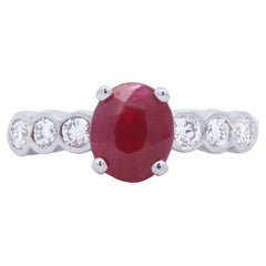 Oval Ruby and Bezel Diamond Set Round Fashion Ring 18K White Gold