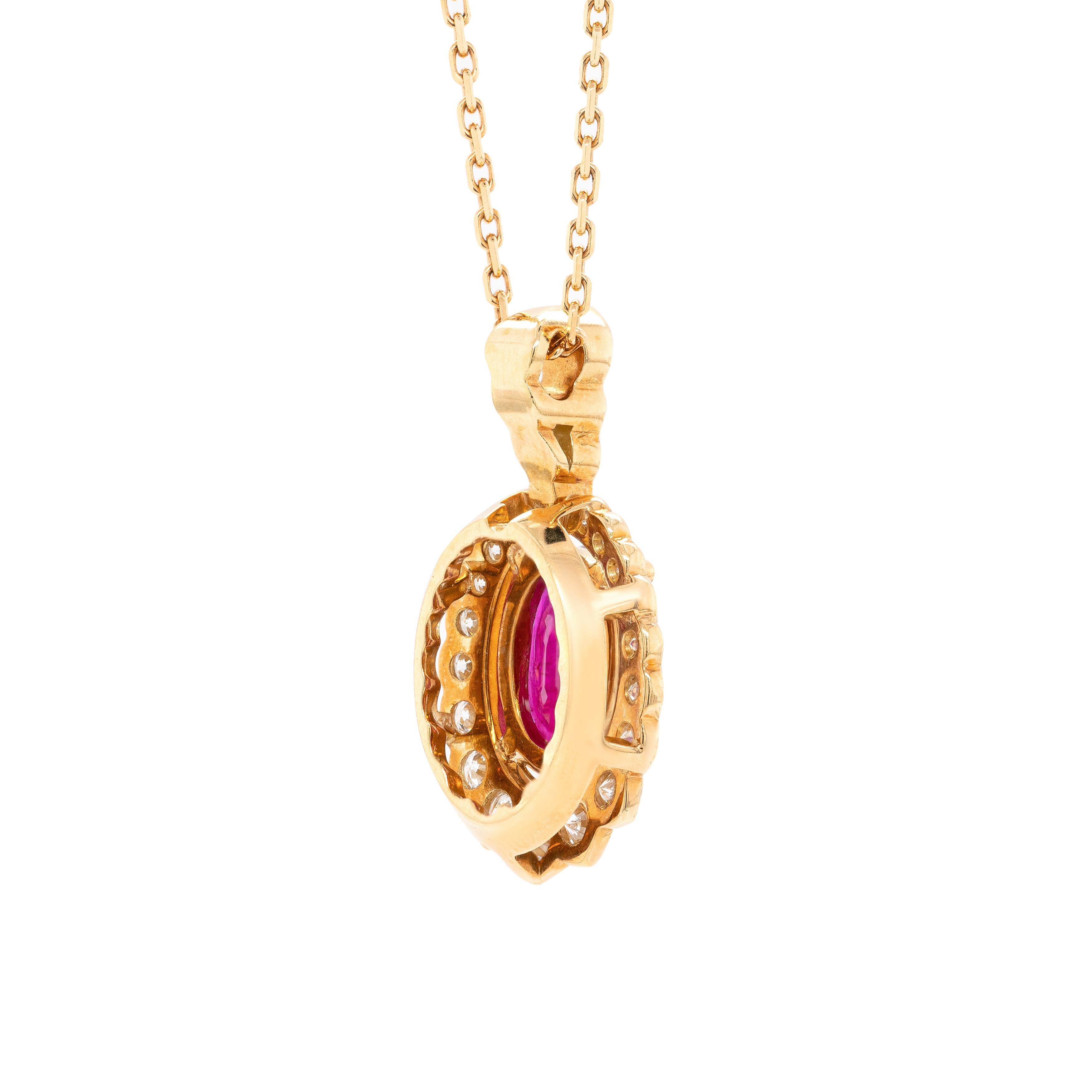 Stunning pendant and chain featuring a beautiful oval shaped ruby weighing 1.55ct in a four claw open-back setting. The ruby is surrounded by 20 fine quality round brilliant cut diamonds graduating from approximately 0.015-0.05ct with 3 additional