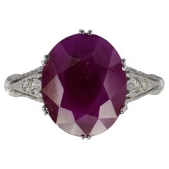 Oval Ruby and Diamond Accent Floral Filigree Ring