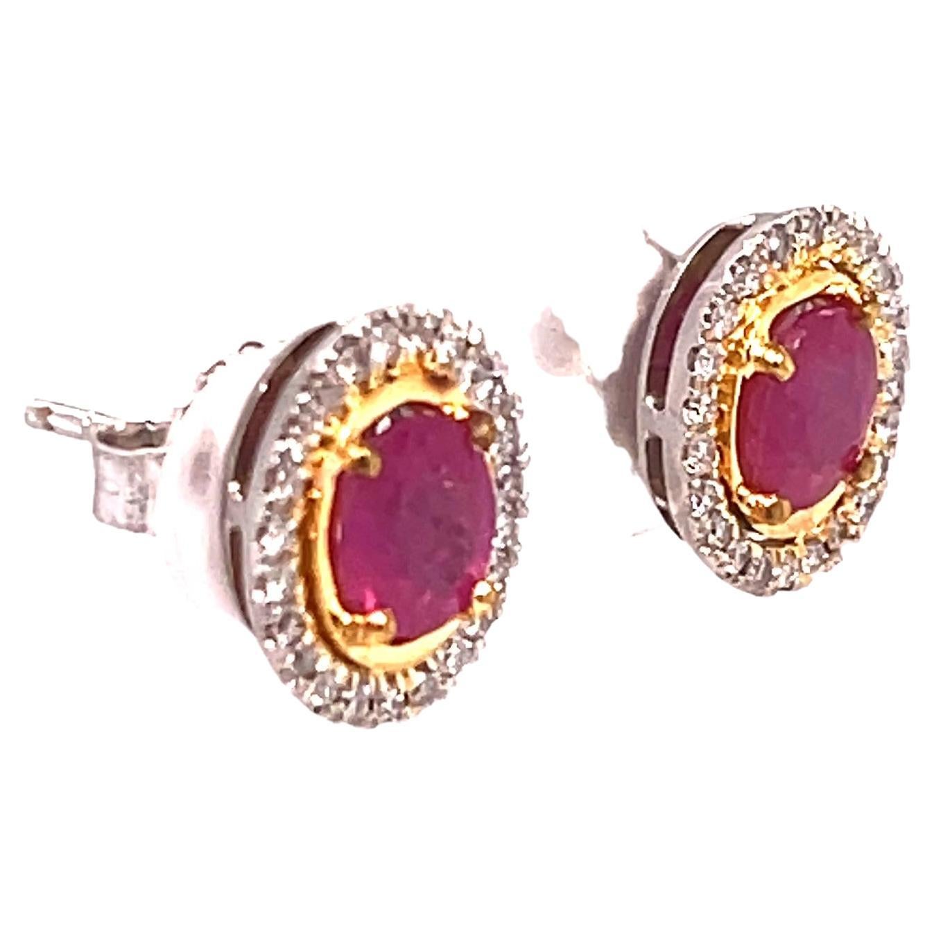 Oval Ruby and Diamond Stud Earrings 2.29 carats 

Oval Ruby weighs 0.86 carat

Oval Ruby weighs 0.93 carat

Total Carat Weight of Rubies 1.79 carats

Measurement: 6.5 x 5.2mm

Round Diamond total carat weight 0.50 carat

G-I Color VS Clarity

TOTAL