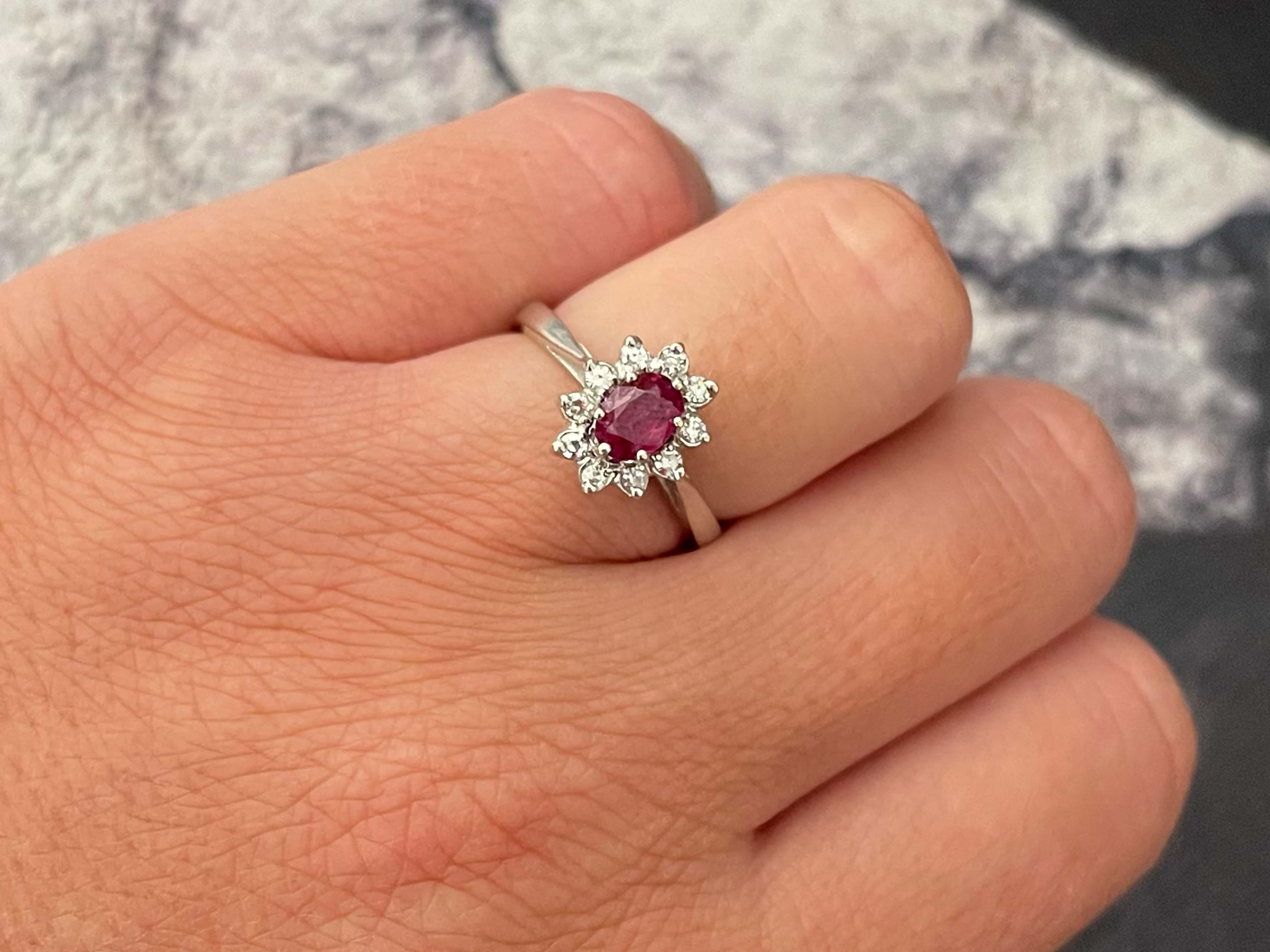 Item Specifications:

Metal: 14K White Gold

Style: Statement Ring

Ring Size: 6.5 (resizing available for a fee)

Total Weight: 3.5 Grams

Gemstone Specifications:

Gemstones: 1 red ruby

Ruby Carat Weight: 0.48 carats

Diamond Carat Weight: 0.05