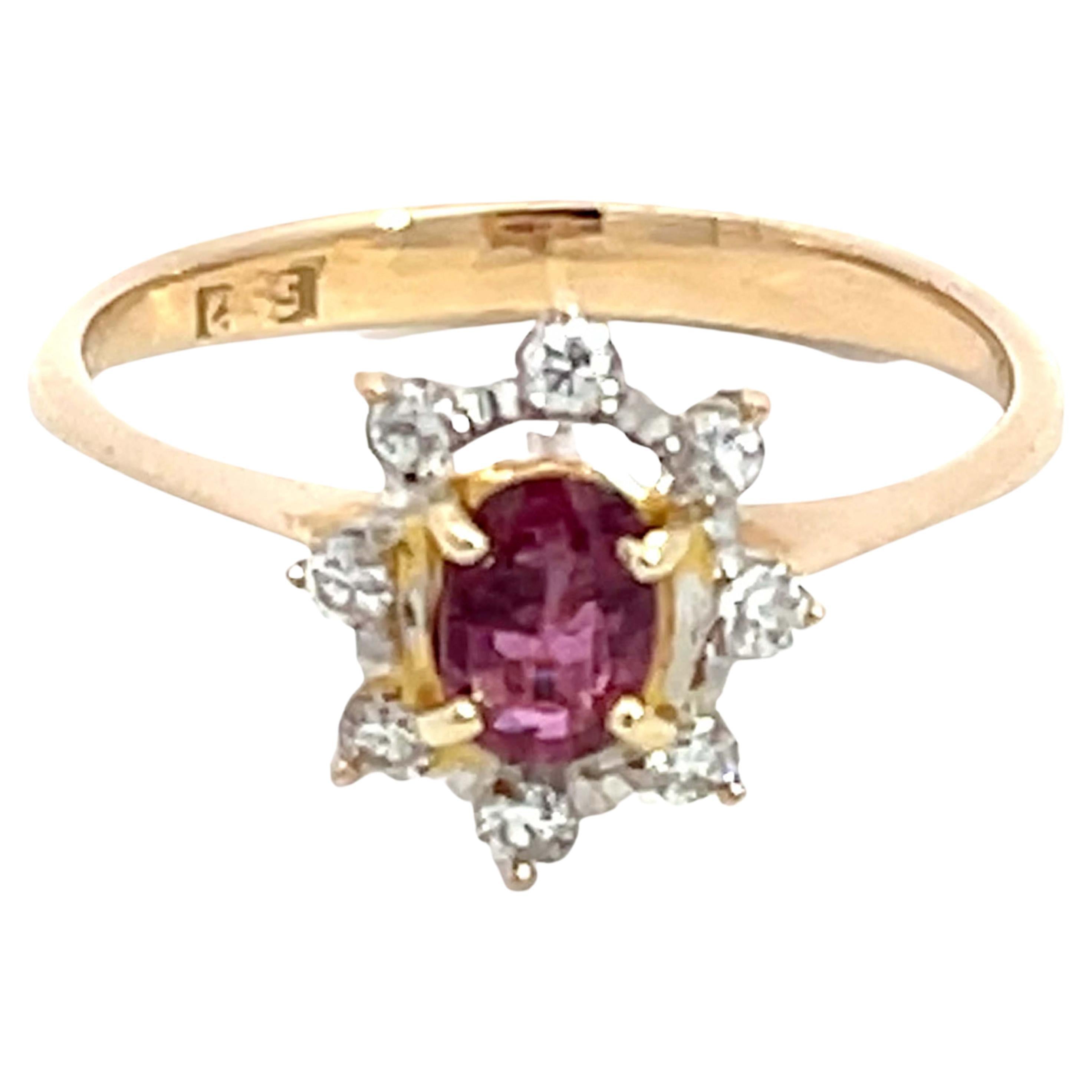Oval Ruby and Diamond Halo Ring in 14k Yellow Gold For Sale