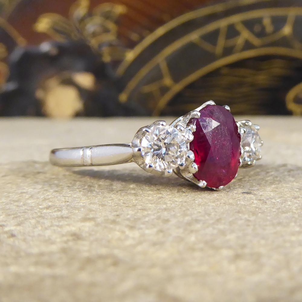 This timeless Ruby and Diamond three stone ring site beautifully on the finger with the 2.00ct Ruby in the centre showing a lovely deep red colour. With two modern brilliant cut Diamond on either side weighing 0.66ct in total. This ring has been