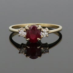 Oval Ruby and Diamond Three-Stone Ring 9 Karat Yellow Gold