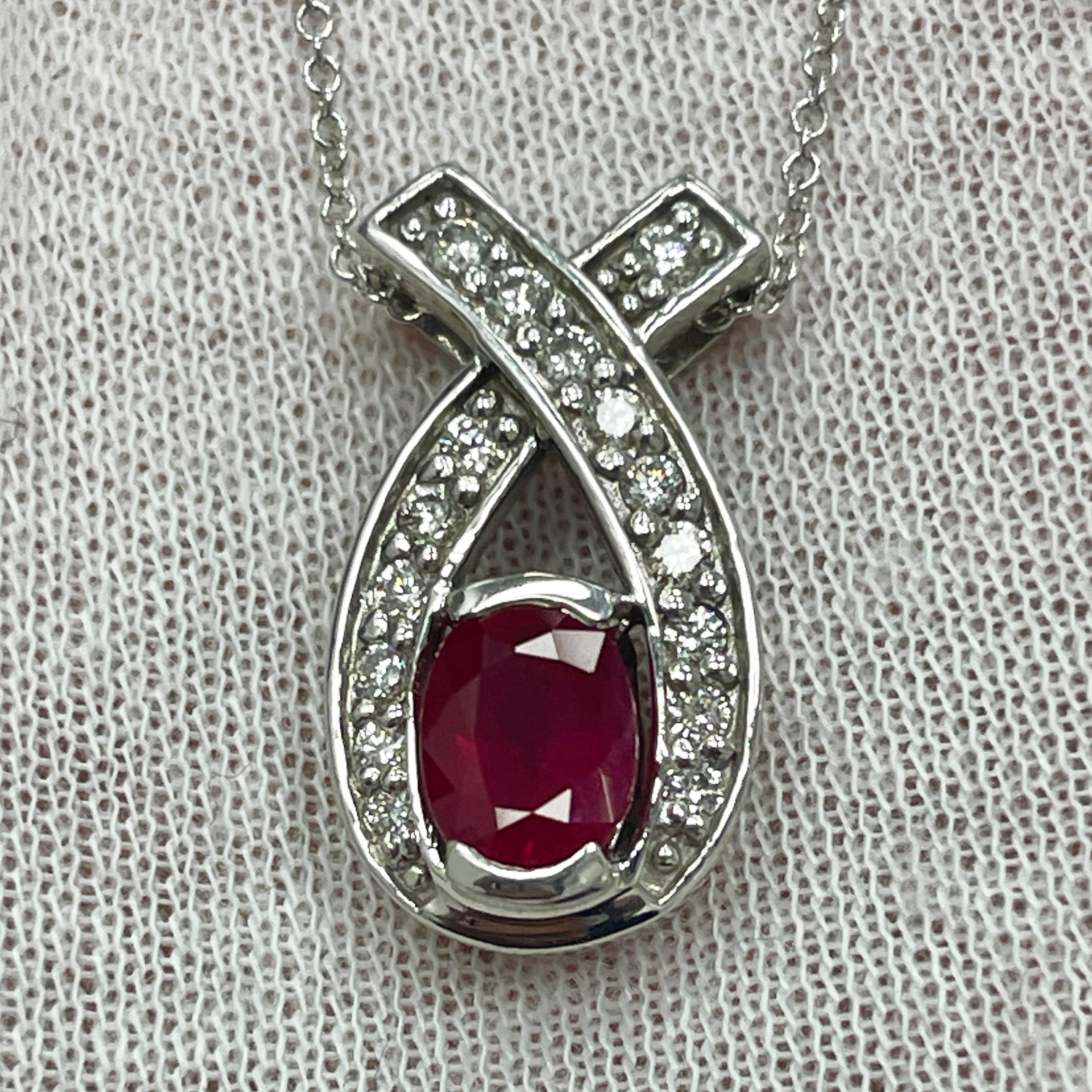 A saturated 1.08Ct ruby in a diamond (0.26Ct) 14K white gold pendant