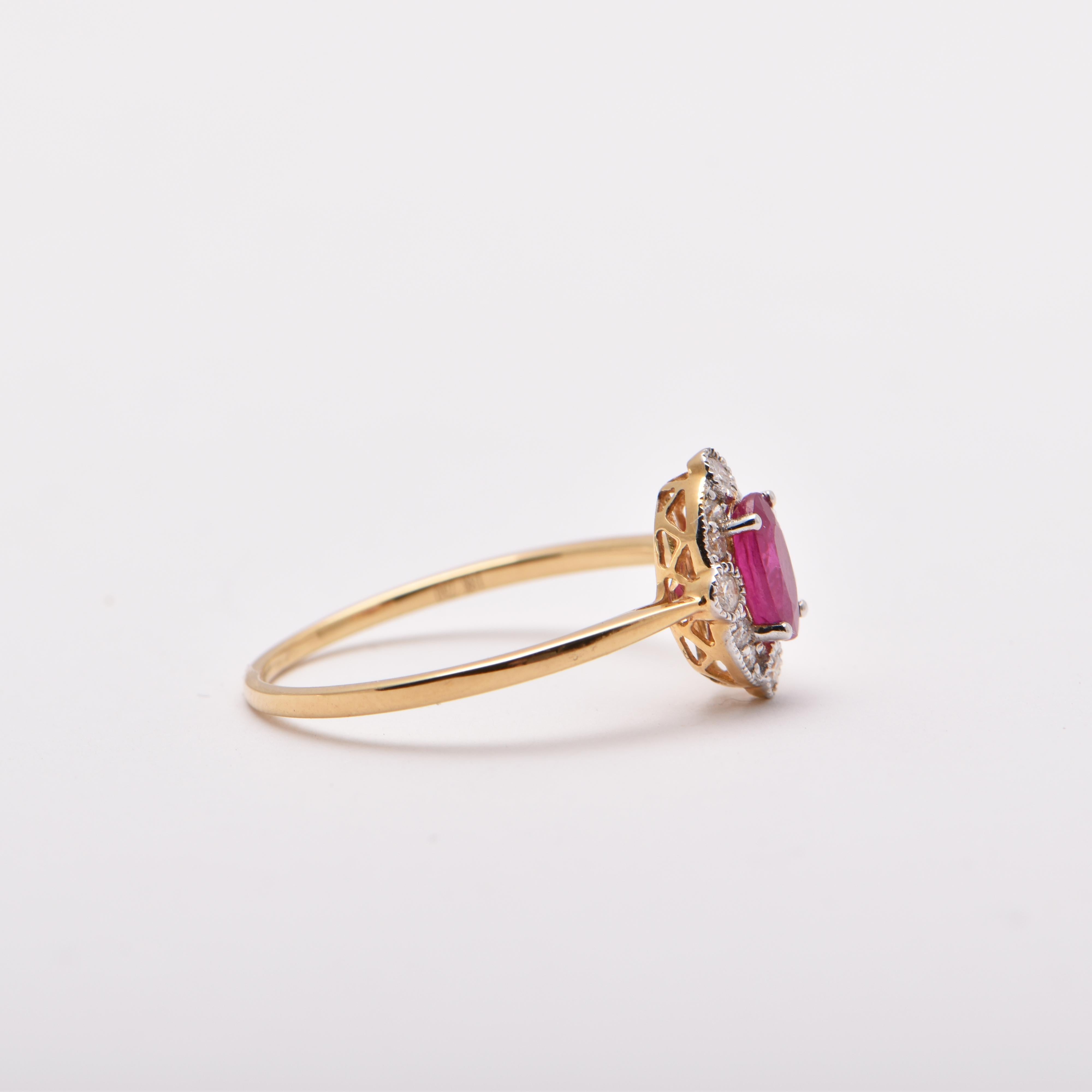 Oval Cut Oval Ruby and Round Diamond Halo Ring in 18 Carat Yellow Gold For Sale
